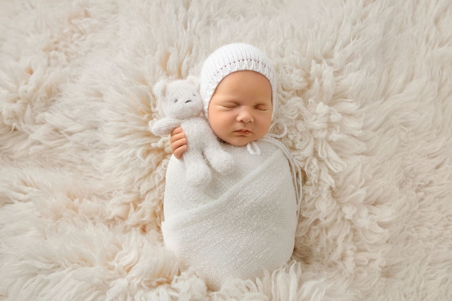 Sleeping newborn with teddy on soft blanket in Lakewood NJ newborn photography session