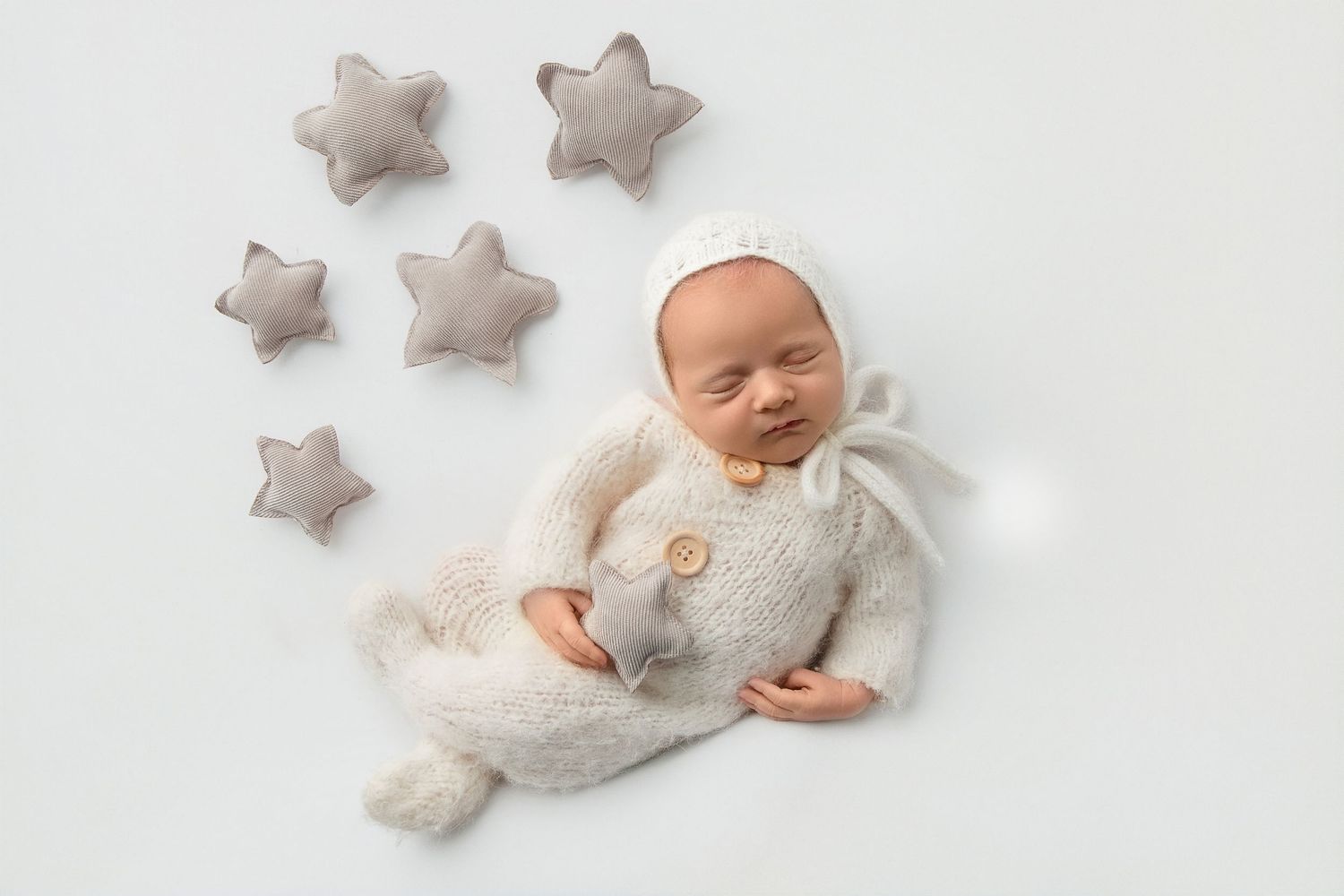 Newborn baby girl resting during studio newborn photography session in Lakewood NJ