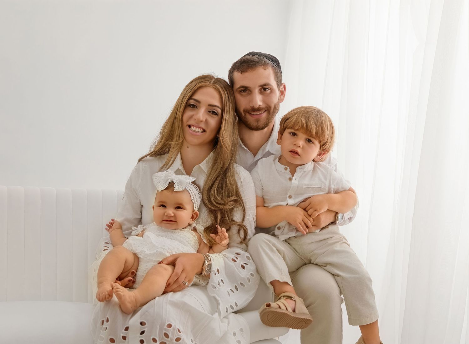 Parents and children enjoying a connection-filled family portrait session in NJ