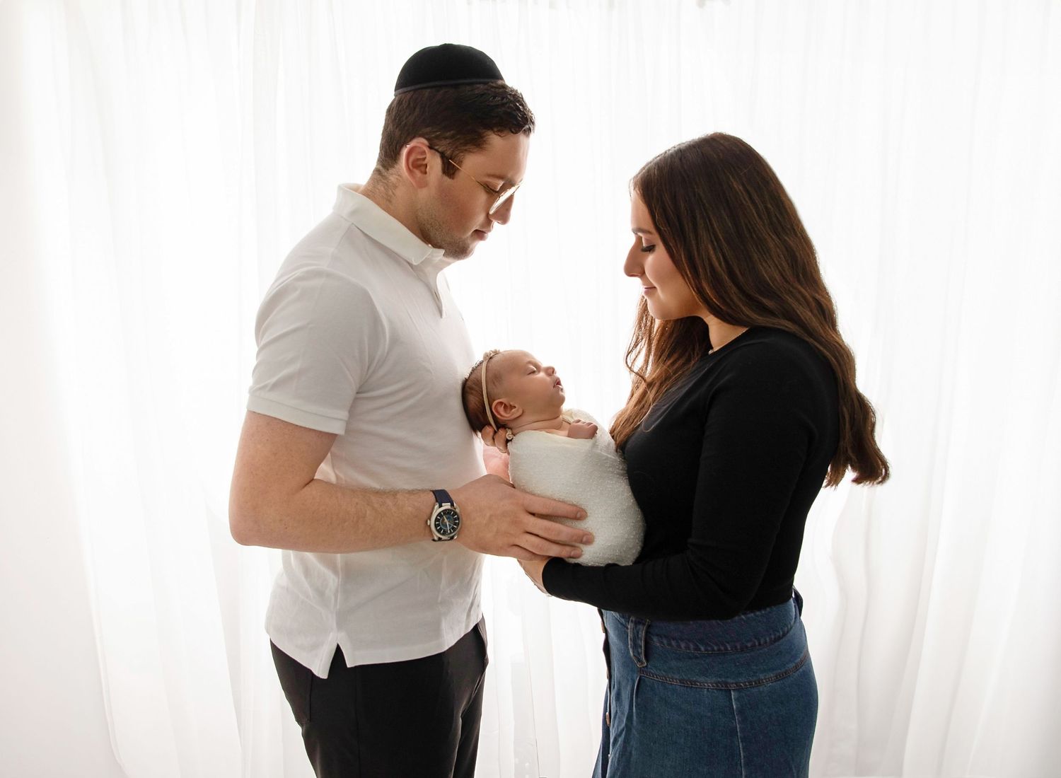 Newborn and family photoshoot, parents holding baby in natural family photography style