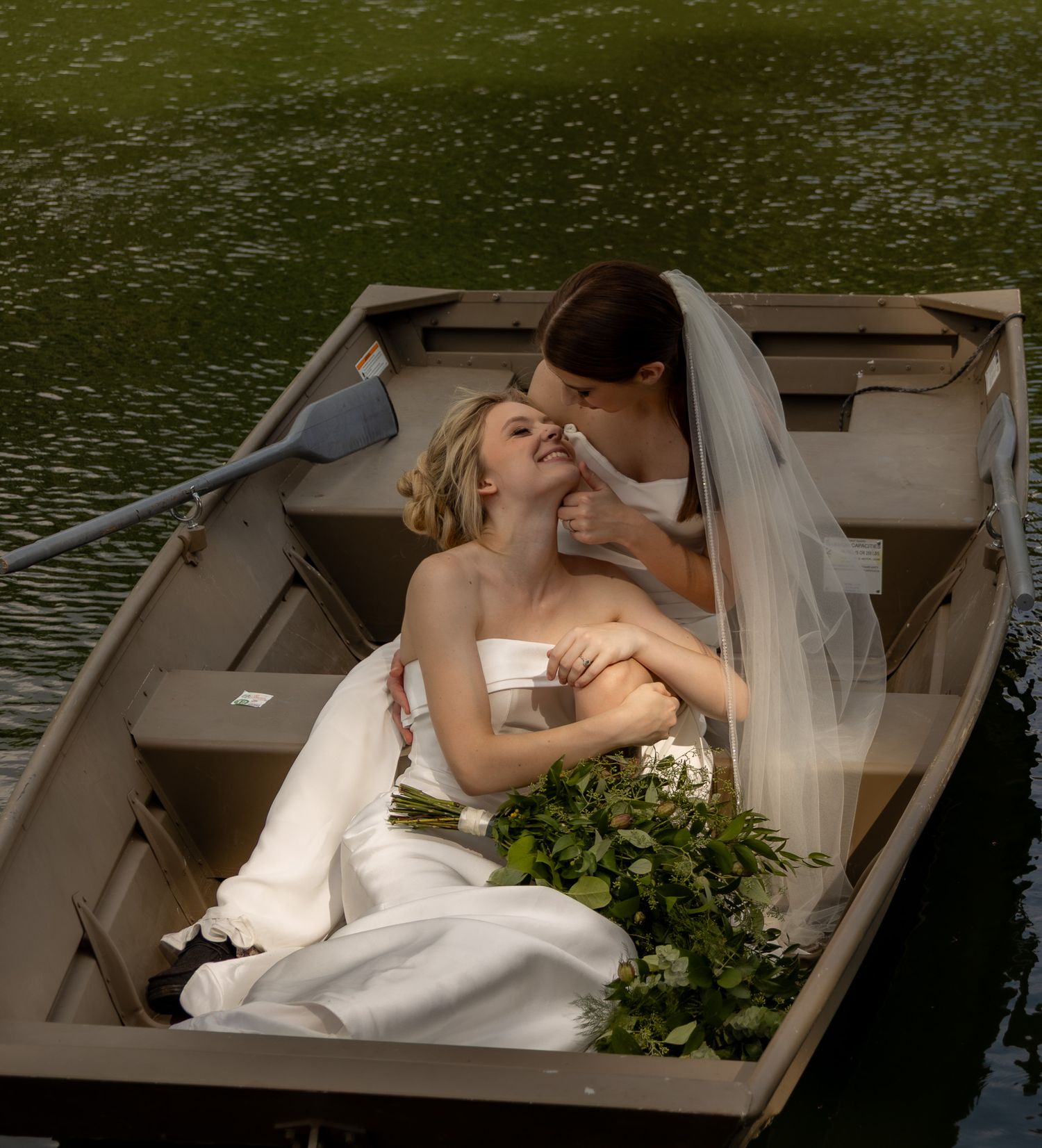 Artistic wedding photography sequence showing a couple in a small boat on a lake with greenery in the background.
