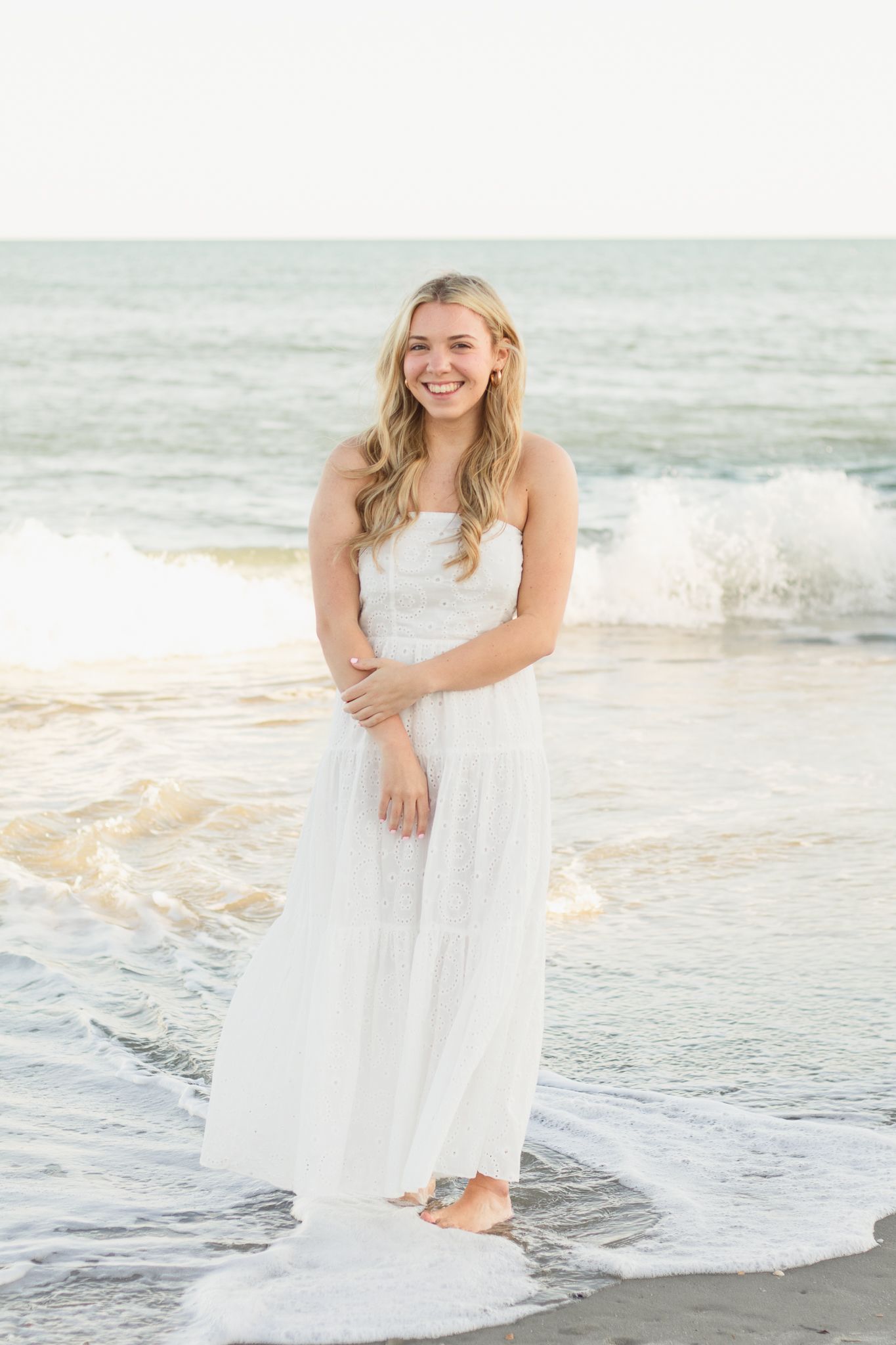 High school senior posing for South Carolina photographer in Myrtle Beach, SC for their senior pictures graduation portraits. Candid