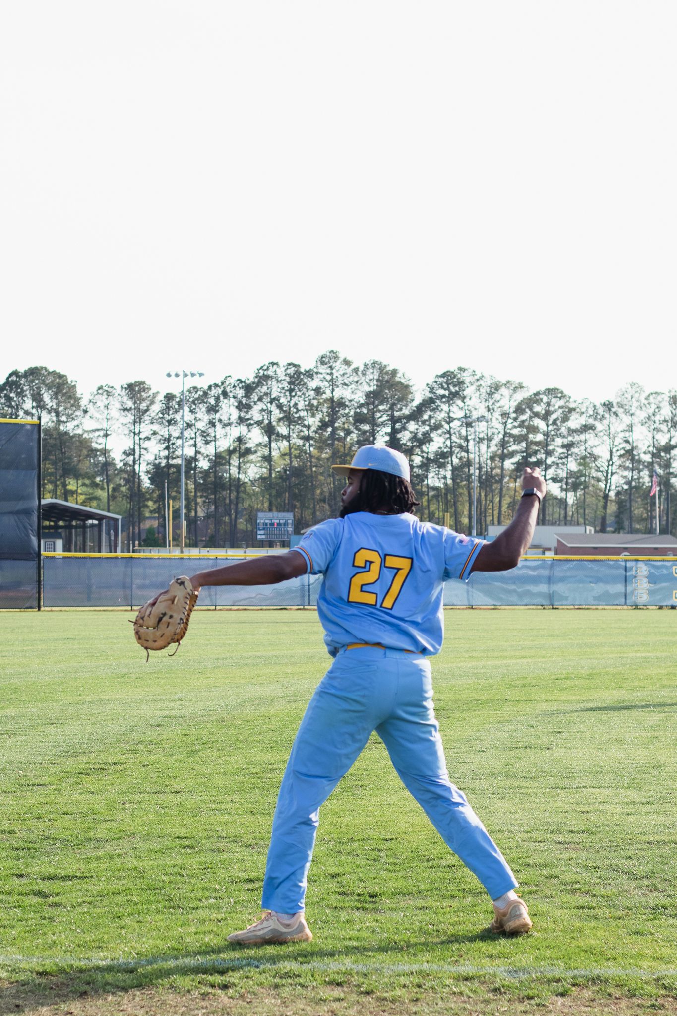 Candid baseball game photography. South Carolina photographer in Florence, SC senior night. Baseball team players sports photos pictures.