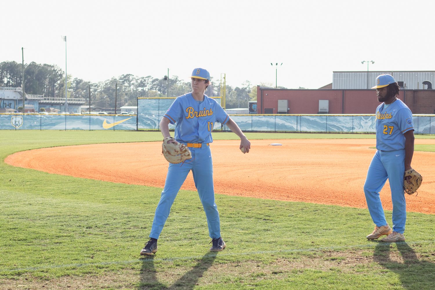 Candid baseball game photography. South Carolina photographer in Florence, SC senior night. Baseball team players sports photos pictures.
