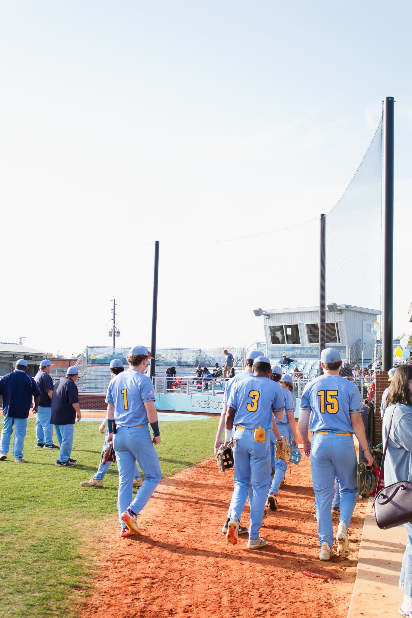 Candid baseball game photography. South Carolina photographer in Florence, SC senior night. Baseball team players sports photos pictures.