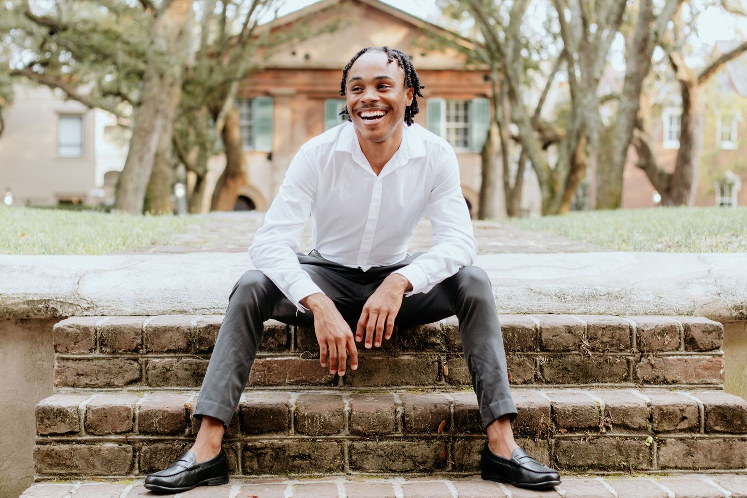 College student posing for South Carolina photographer in Charleston, SC for pictures portraits headshots professional. True to color candid