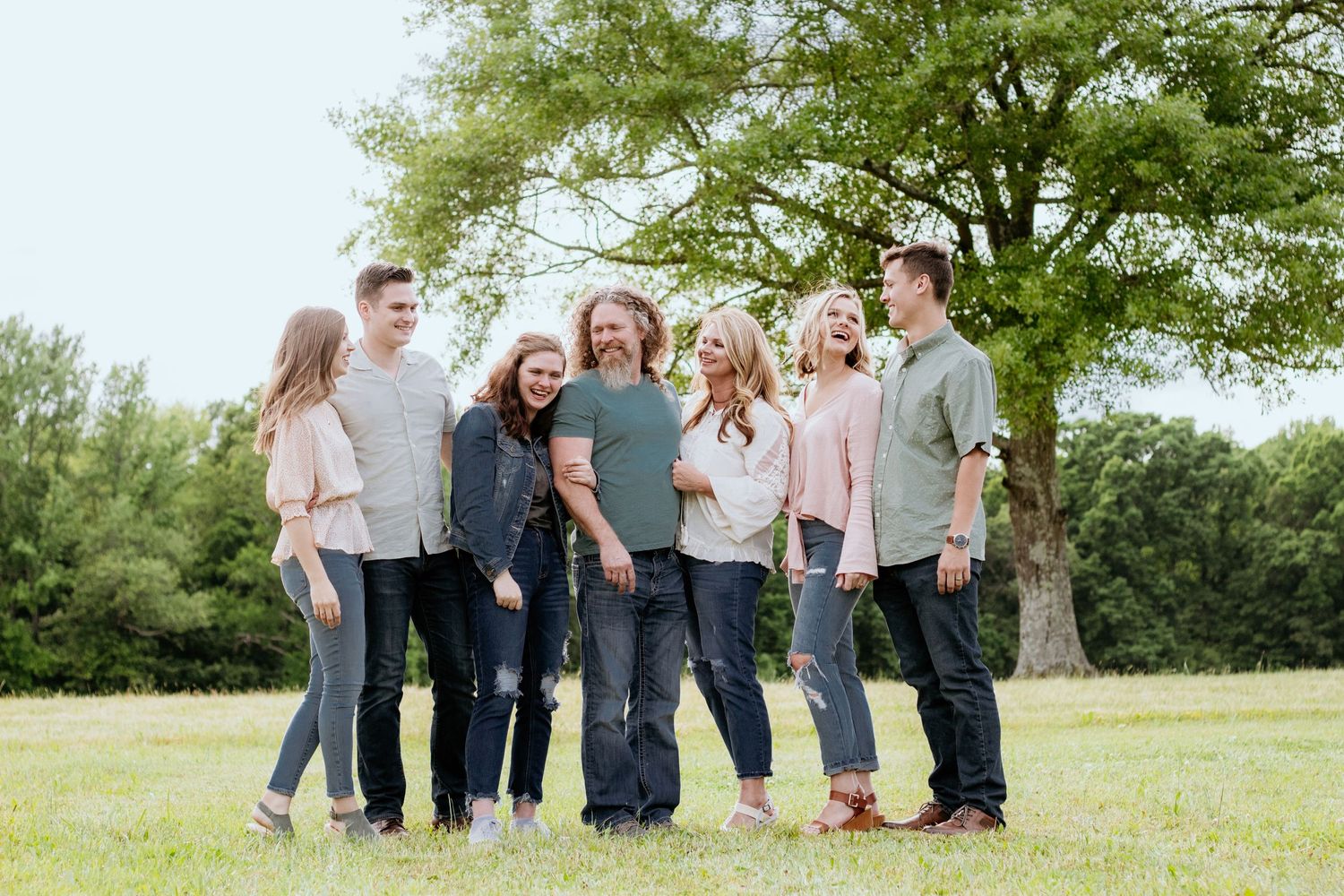 Family posing for South Carolina photographer upstate SC family portraits photography pictures. True to color candid spring affordable