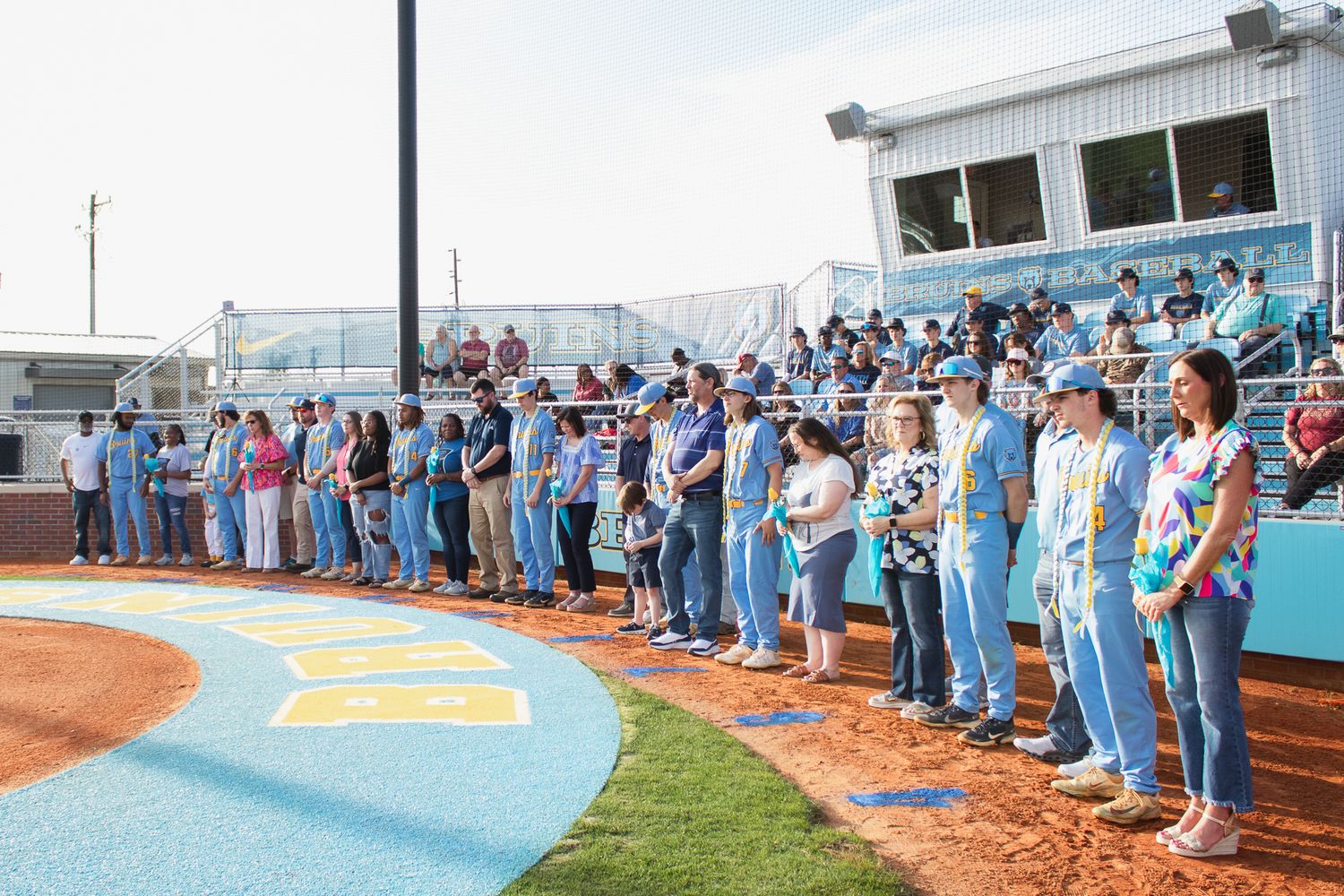 Candid baseball game photography. South Carolina photographer in Florence, SC senior night. Baseball team players sports photos pictures.