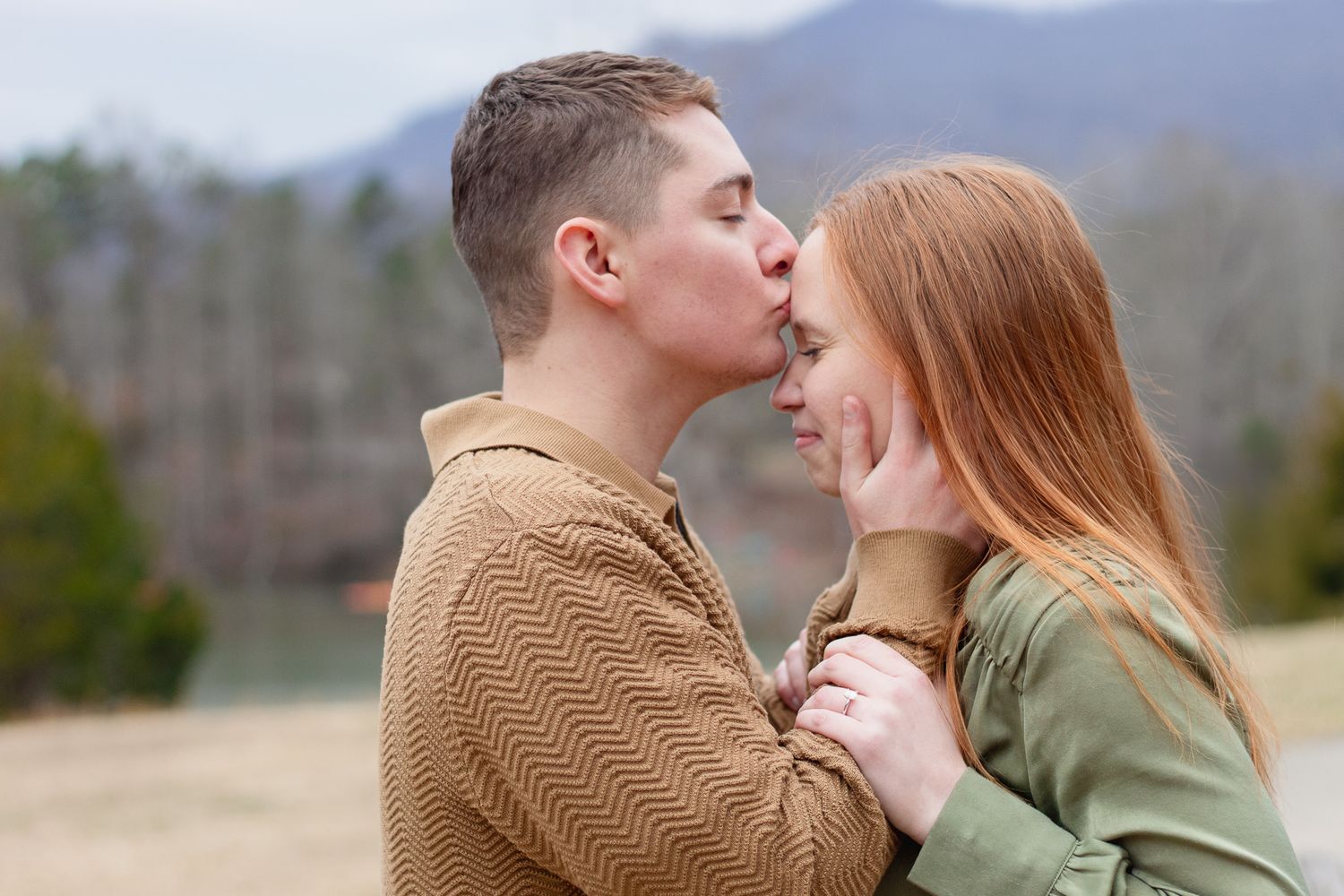 Couple posing for South Carolina photographer at Table Rock park Greenville engagement portraits photoshoot. Candid true to color upstate sc