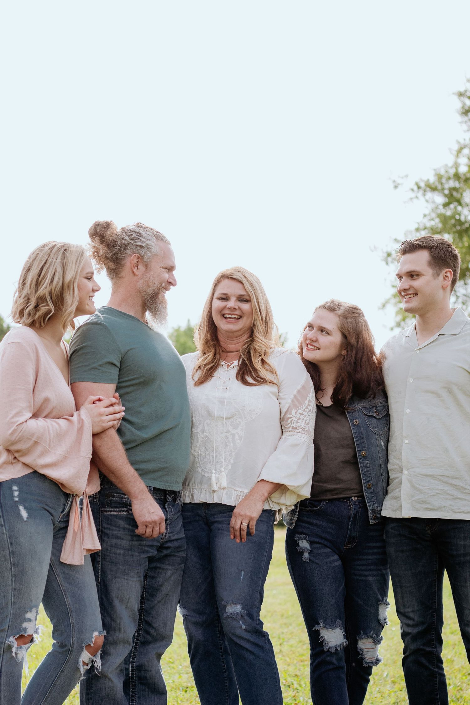 Family posing for South Carolina photographer upstate SC family portraits photography pictures. True to color candid spring affordable