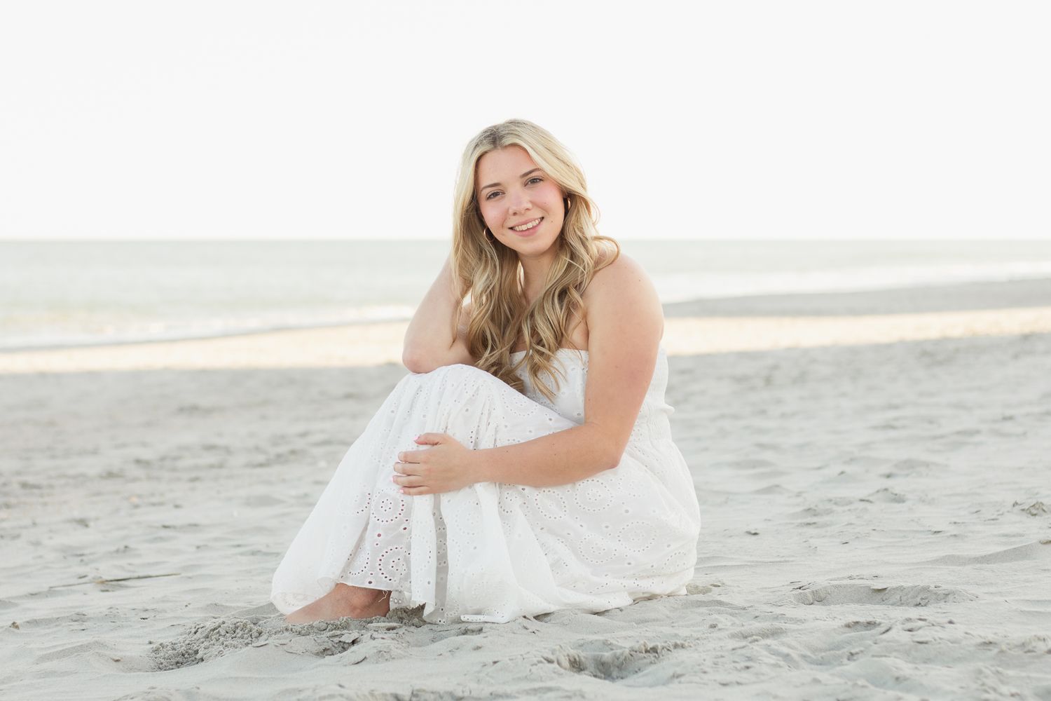 High school senior posing for a South Carolina photographer in Myrtle Beach, SC for their senior pictures graduation portraits.