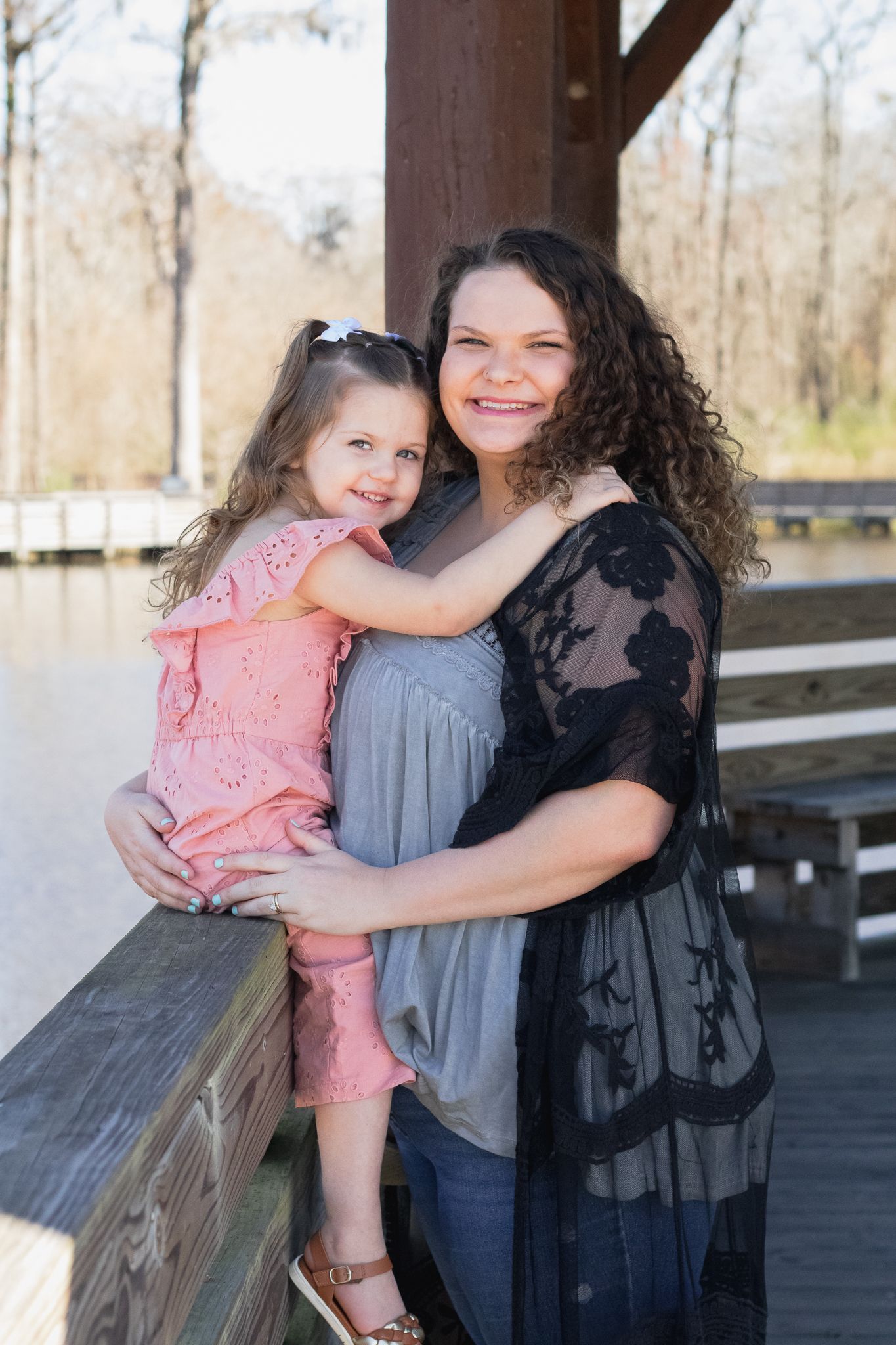 Family posing for South Carolina photographer in Lake City SC mommy portraits photoshoot. Candid true to color family pictures children