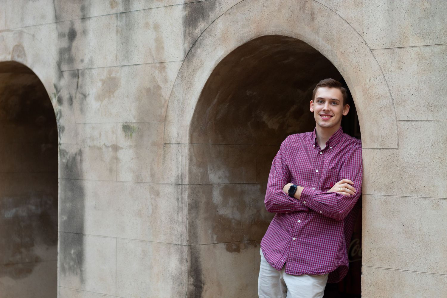 College student posing for South Carolina photographer in Charleston, SC for pictures portraits headshots professional. True to color candid