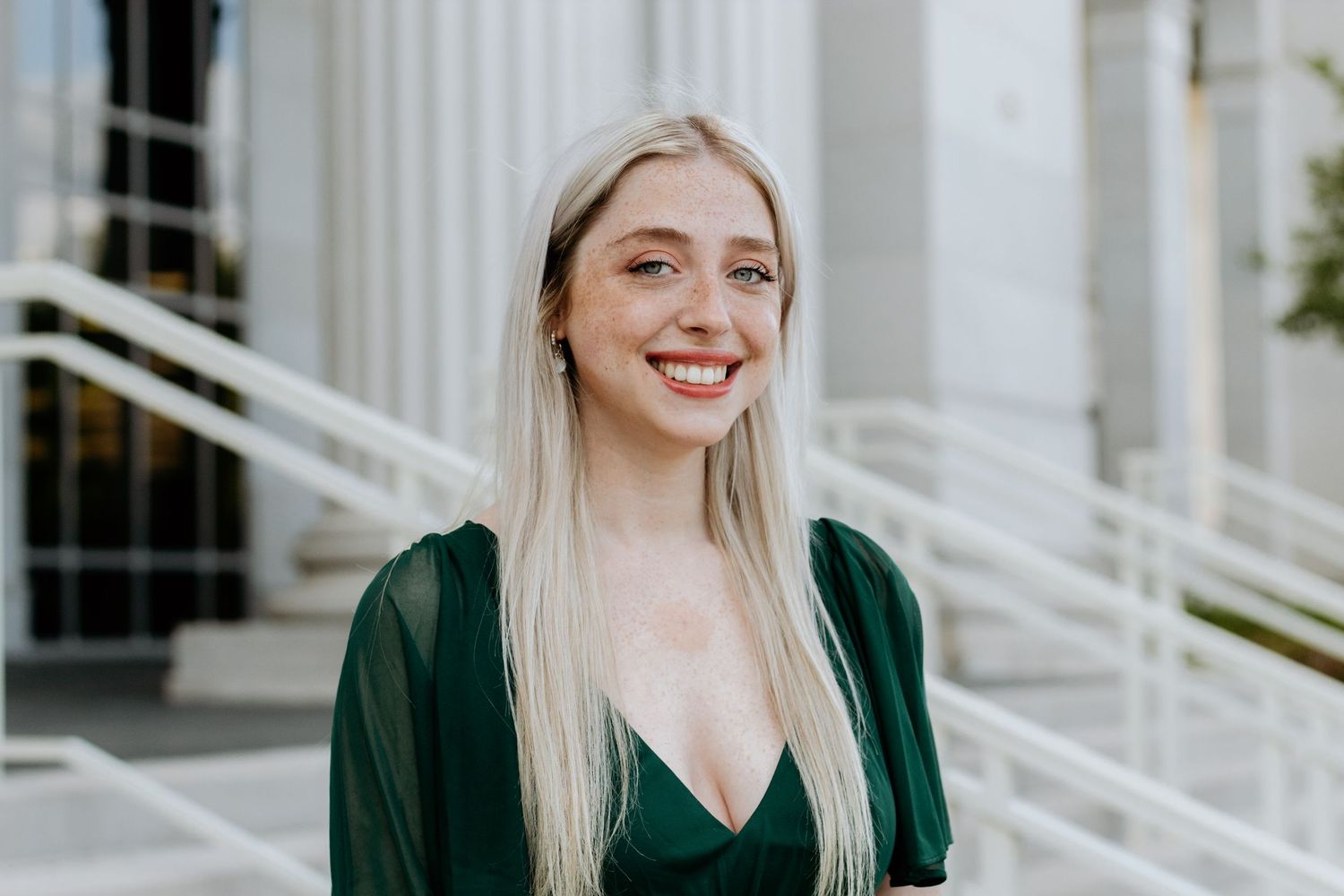 College student posing for South Carolina photographer in Florence, SC for pictures portraits headshots professional. True to color candid
