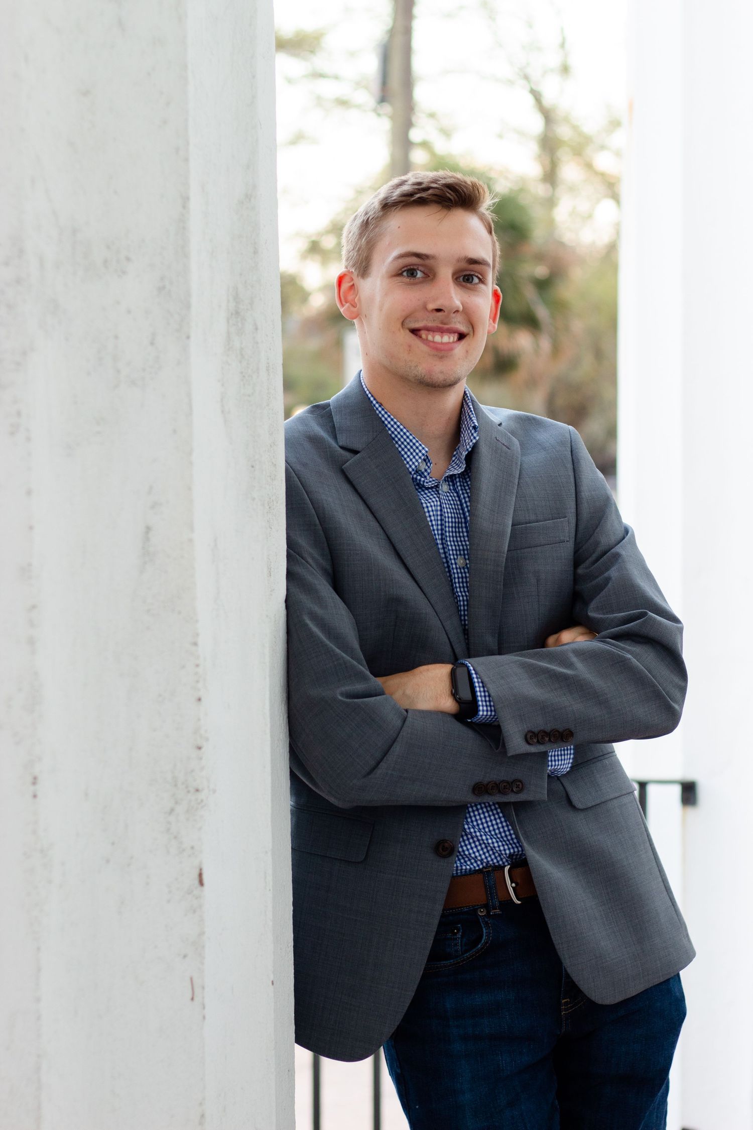 College student posing for South Carolina photographer in Charleston, SC for pictures portraits headshots professional. True to color candid