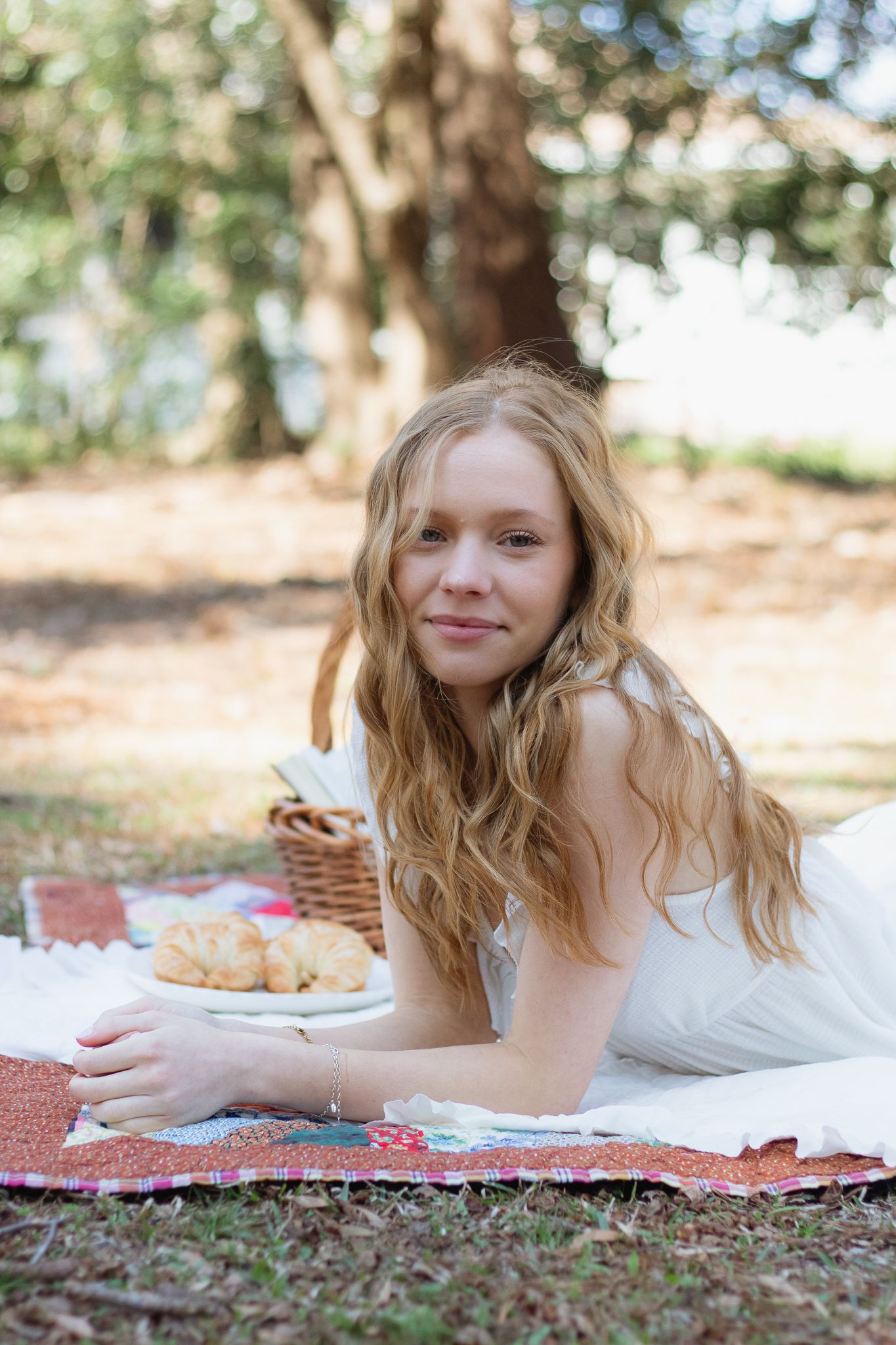 Blonde woman posing for portraits for South Carolina photographer picnic themed photoshoot. Spring photography candid true to color minis