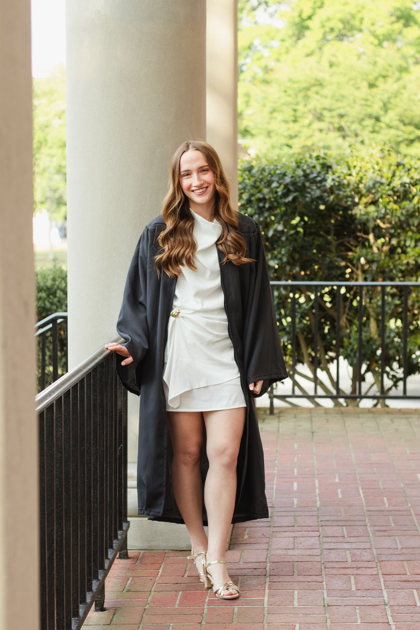 High school senior posing for a South Carolina photographer in Hartsville, SC for their senior pictures graduation portraits. garden candid