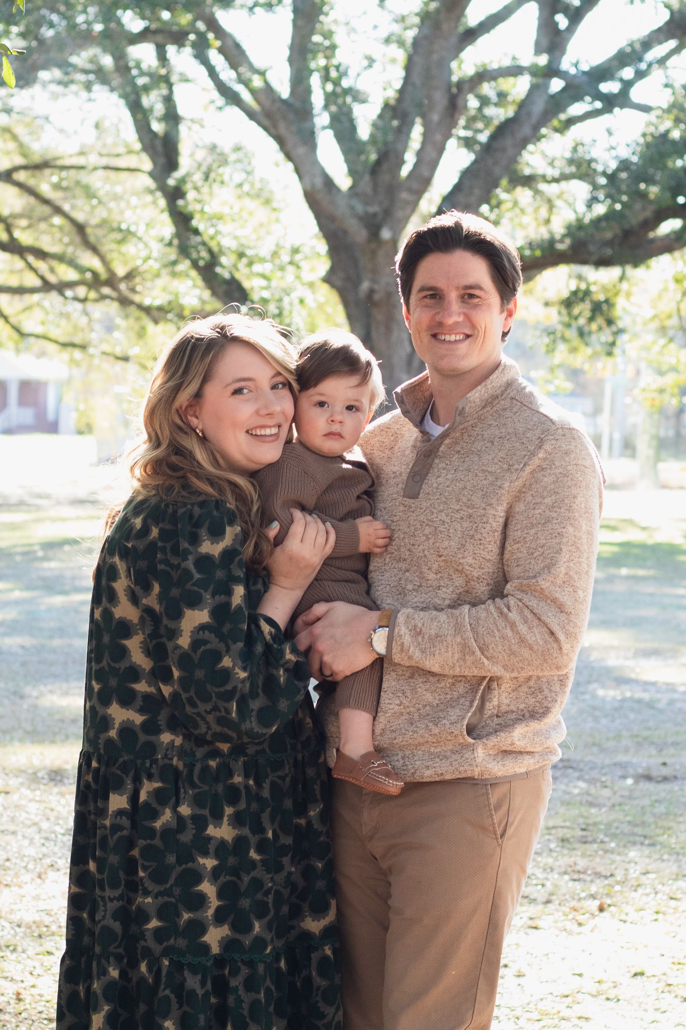 Family posing for South Carolina photographer in Florence SC engagement portraits photoshoot. Candid true to color family pictures children