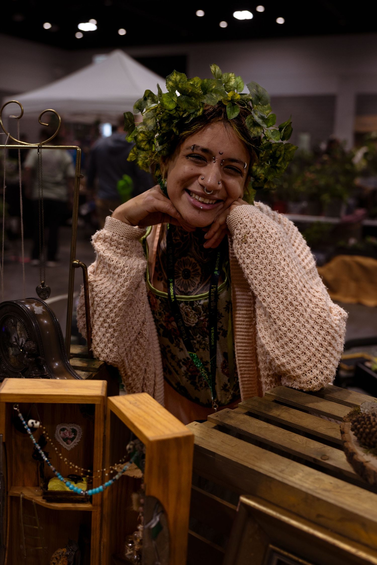 A series of candid shots showing someone wearing a knit sweater leaning on wooden furniture in an indoor setting.