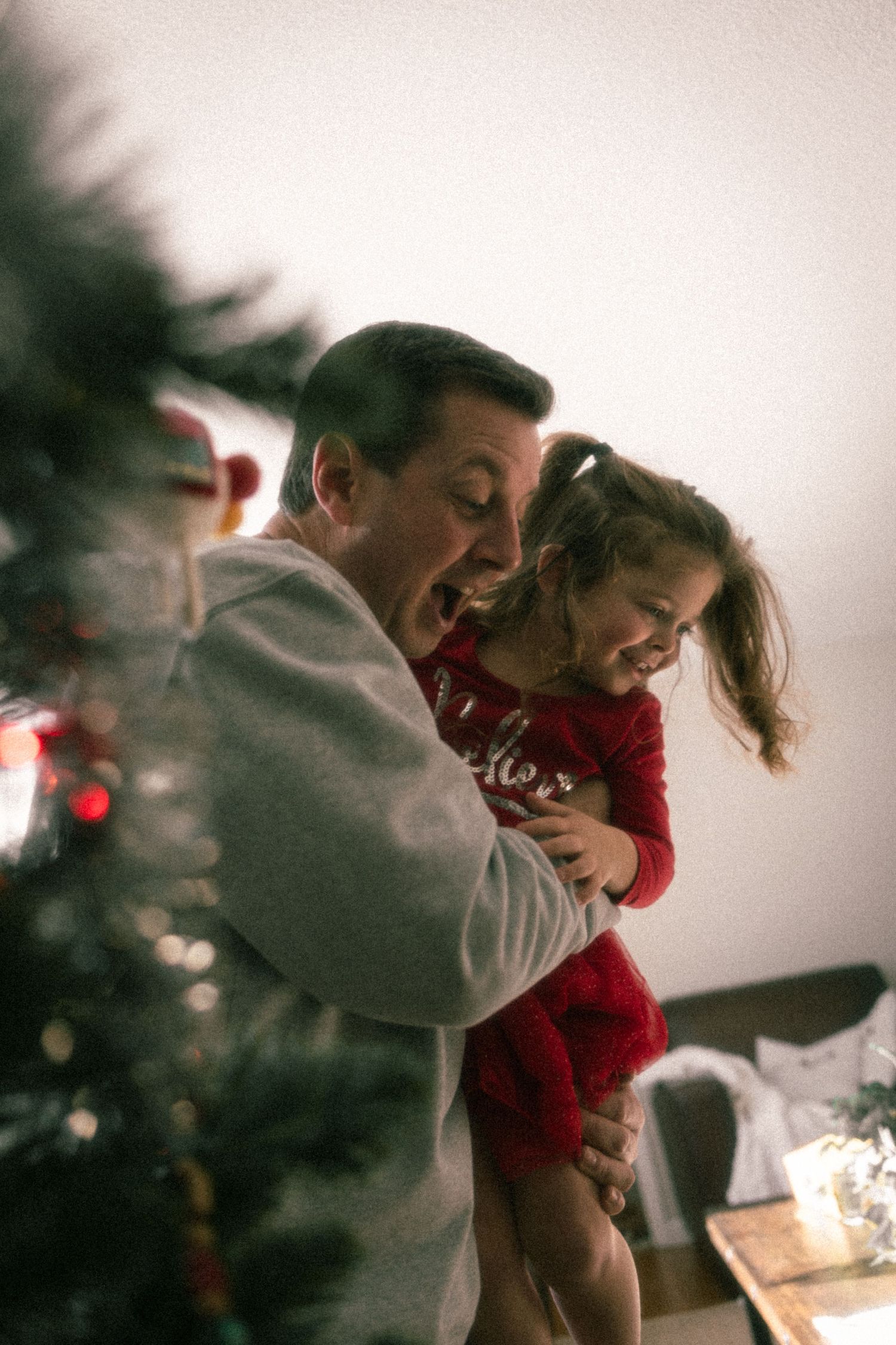 A sequence of motion shots showing a couple dancing together in a warm, intimate setting with soft lighting.