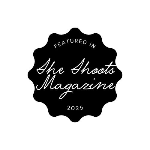 Set of four black decorative badges with elegant script text and vintage design elements.