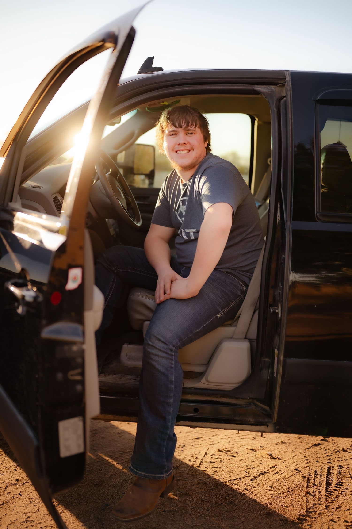 Multiple views of someone getting into and sitting in a parked vehicle during golden hour.
