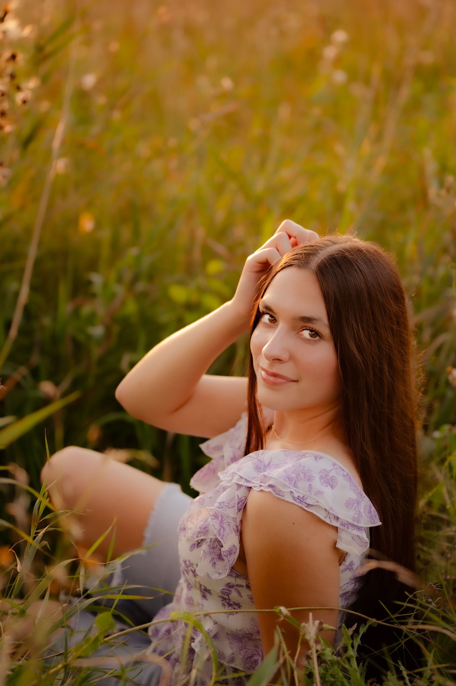 Dreamy sunset portraits among wildflowers with warm golden lighting.