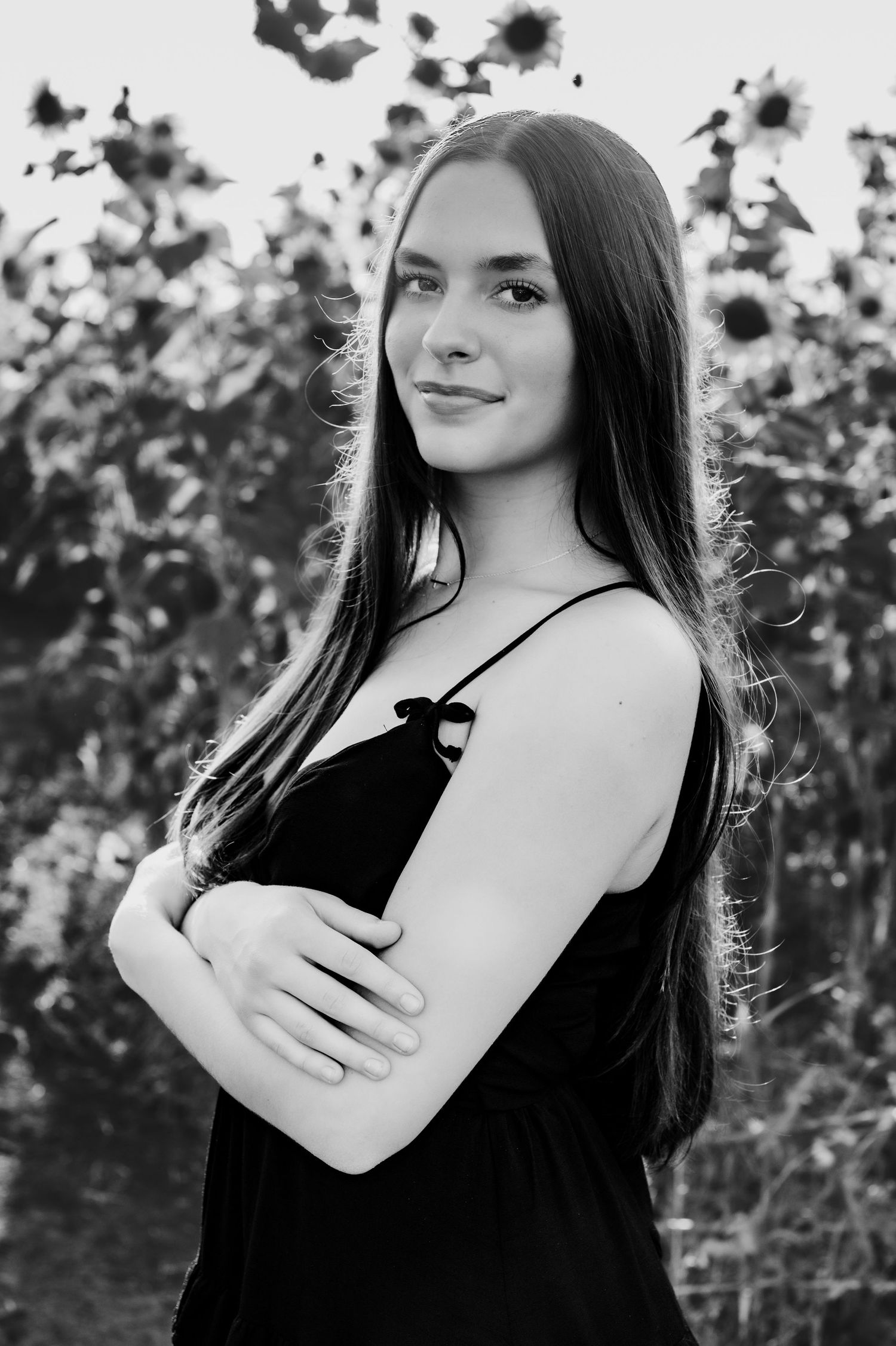 Black and white portrait series showing a person with long dark hair in a sleeveless top against a floral background.