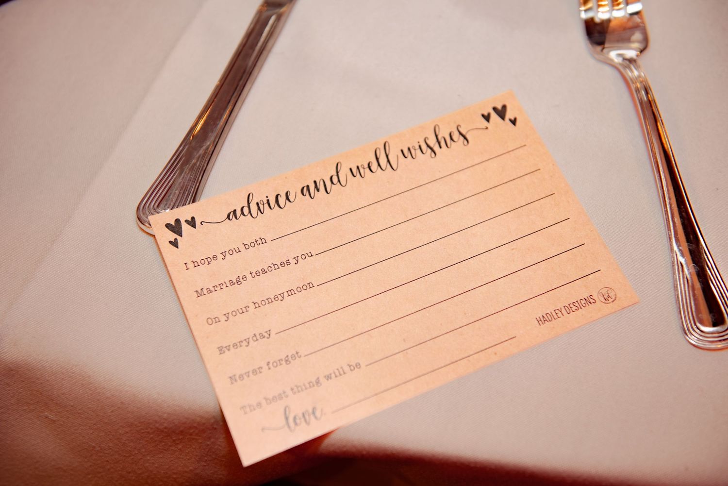 Wedding advice card with decorative elements and blank lines for guests to fill in.
