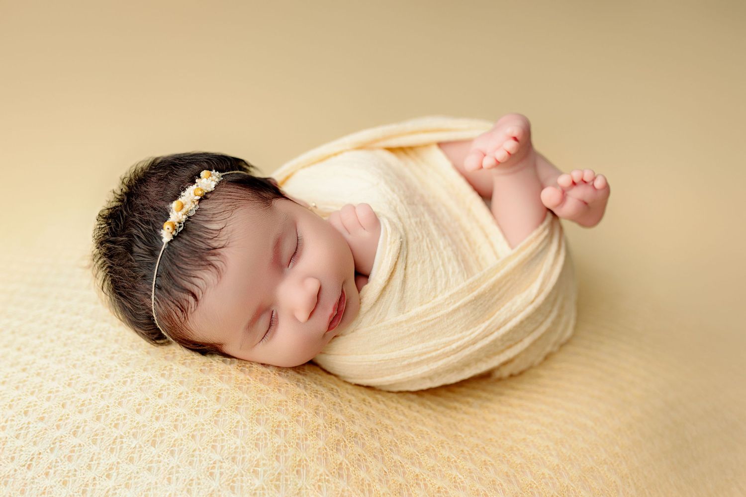 Newborn baby girl yellow swaddle and background central indiana newborn studio