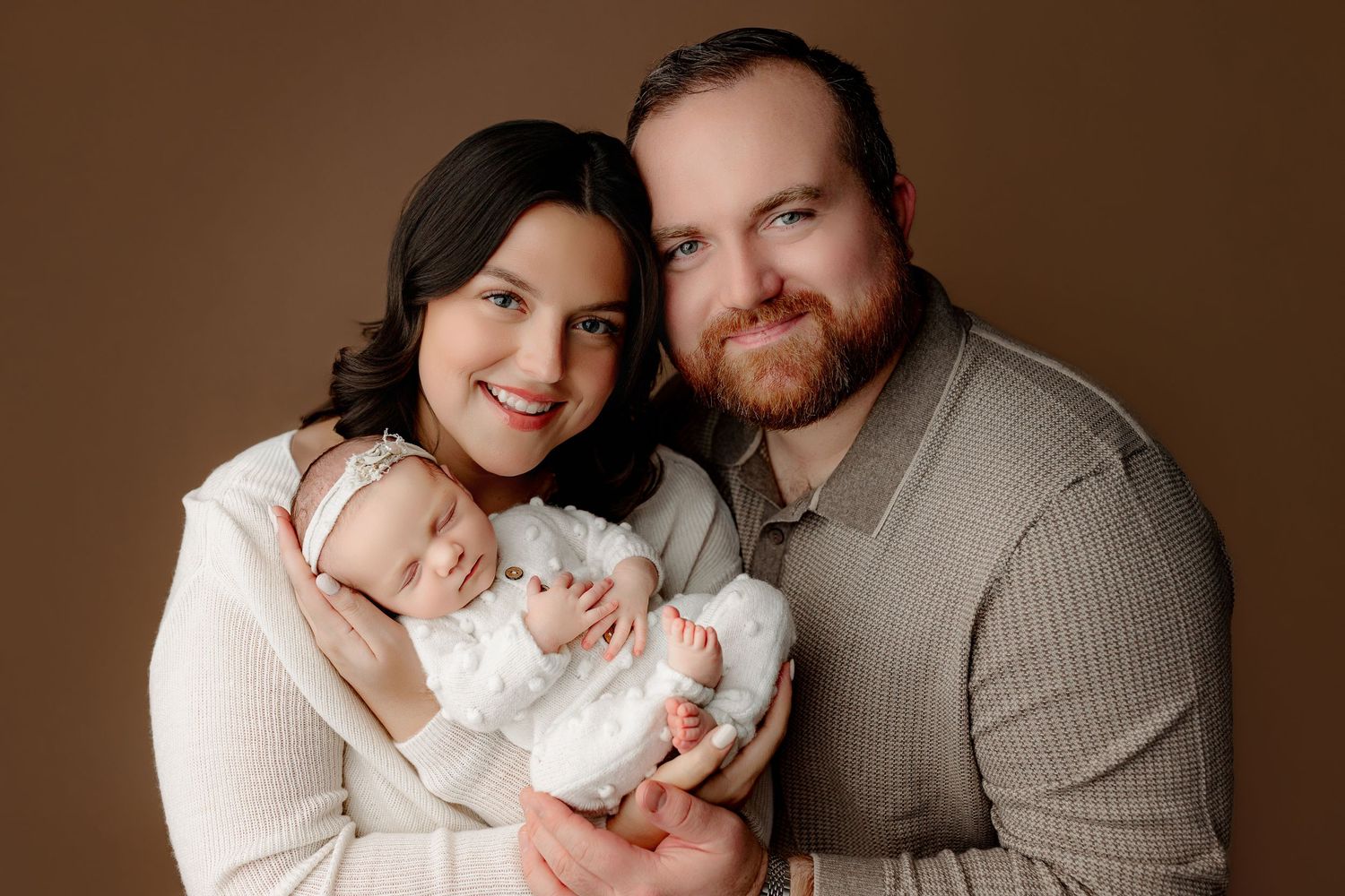 Mom and dad posing with baby girl newborn session Indianapolis