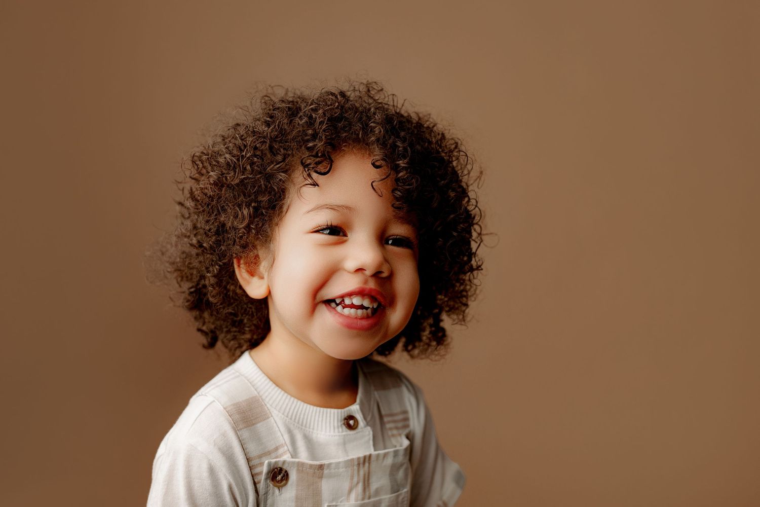 Indianapolis children photographer smiling toddler on neutral background