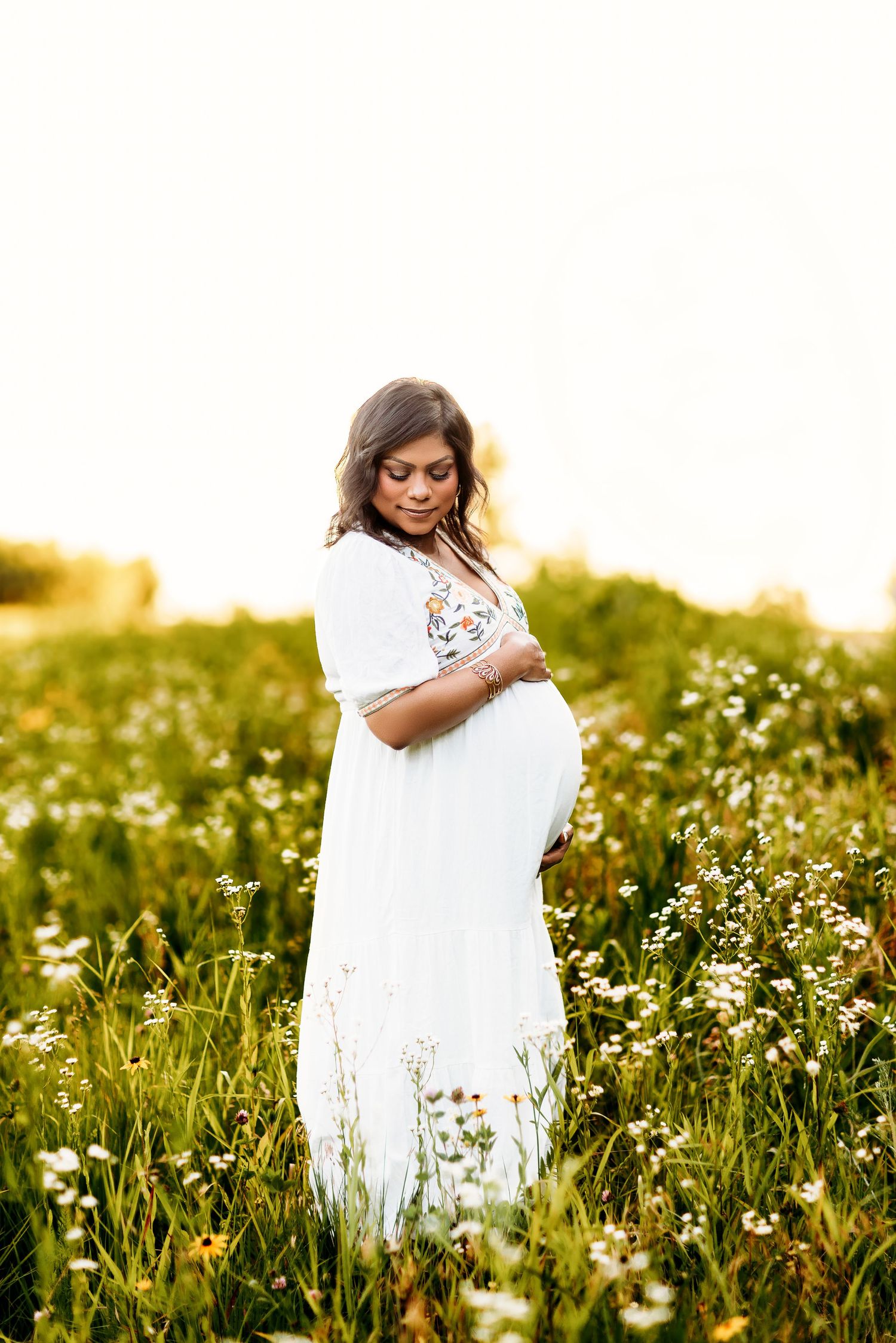 Carmel maternity session in flower field mom in white dress golden hour
