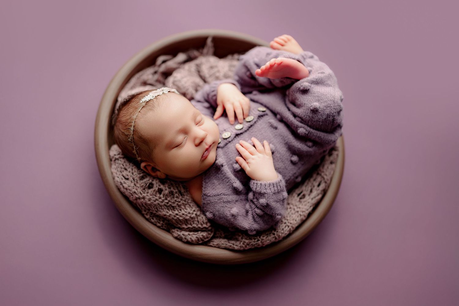 Central Indiana newborn photographer baby posed with purple set up