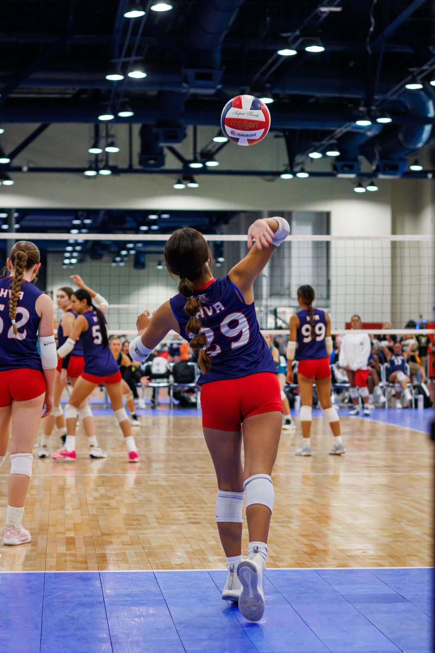 Houston Volleyball Academy 16U volleyball athlete serving during a match at Houston tournament.