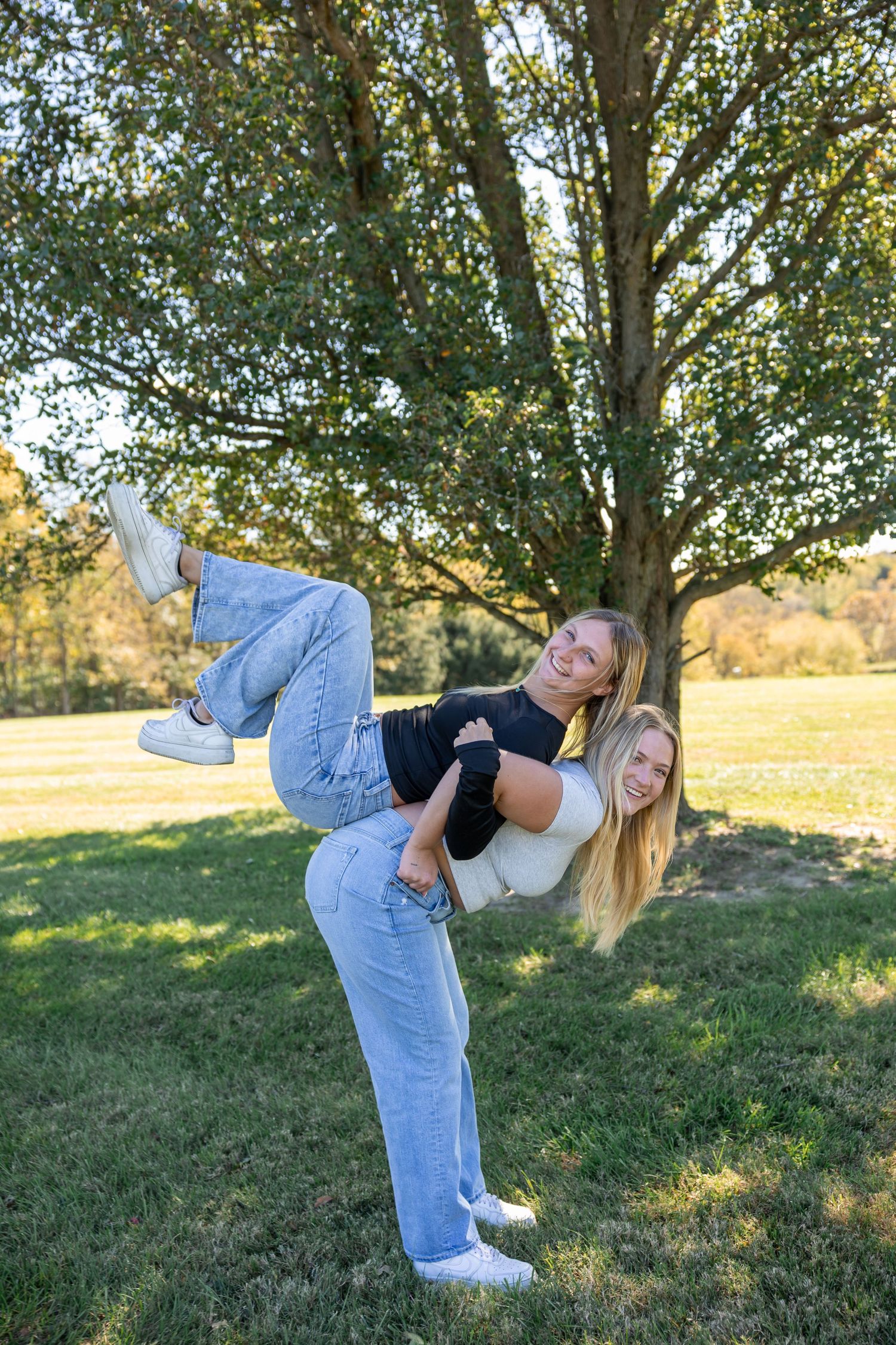 Playful dance moves captured in sequence on grassy hillside.