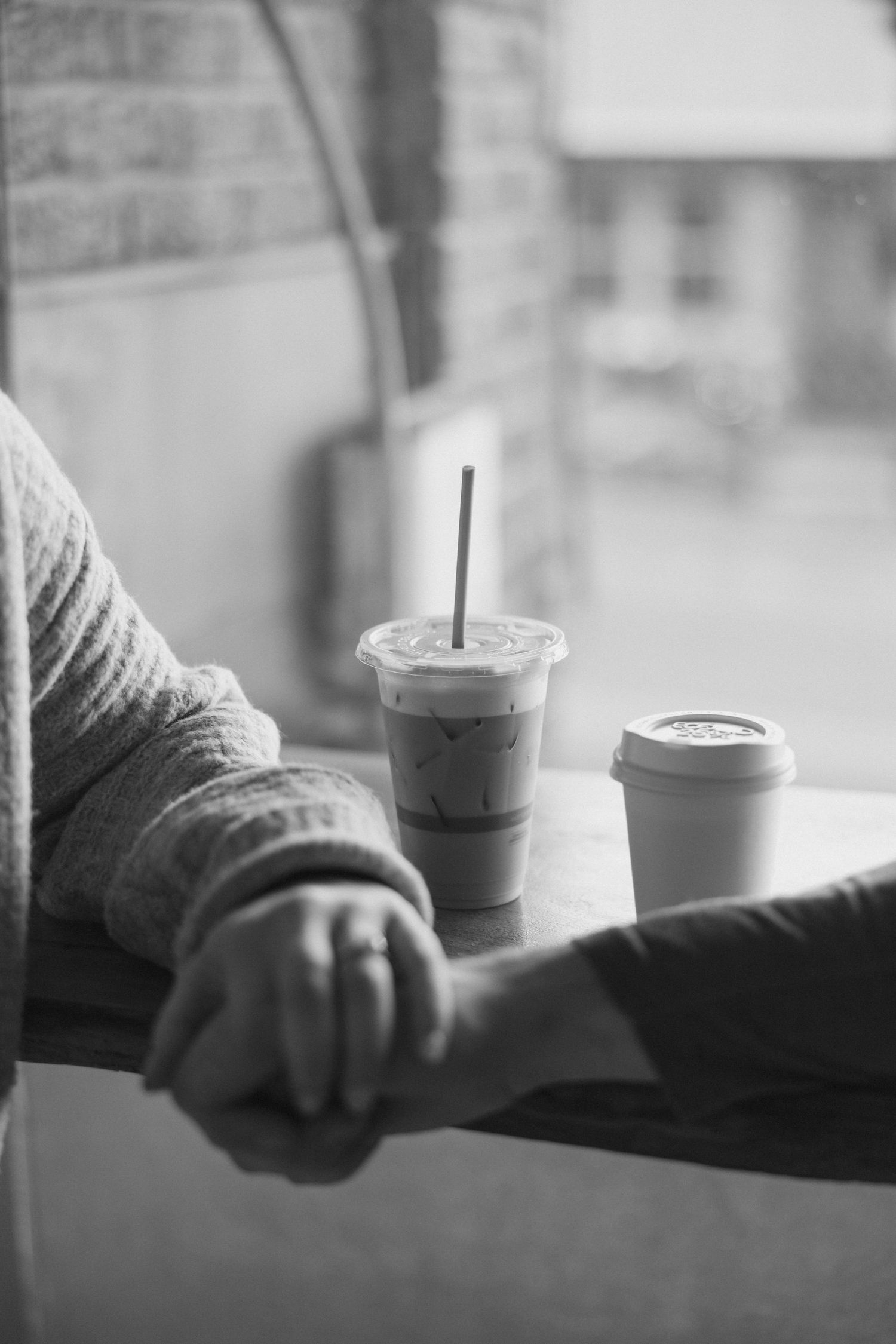 Holding hands with coffee cups. Maddi Randolph Photography.