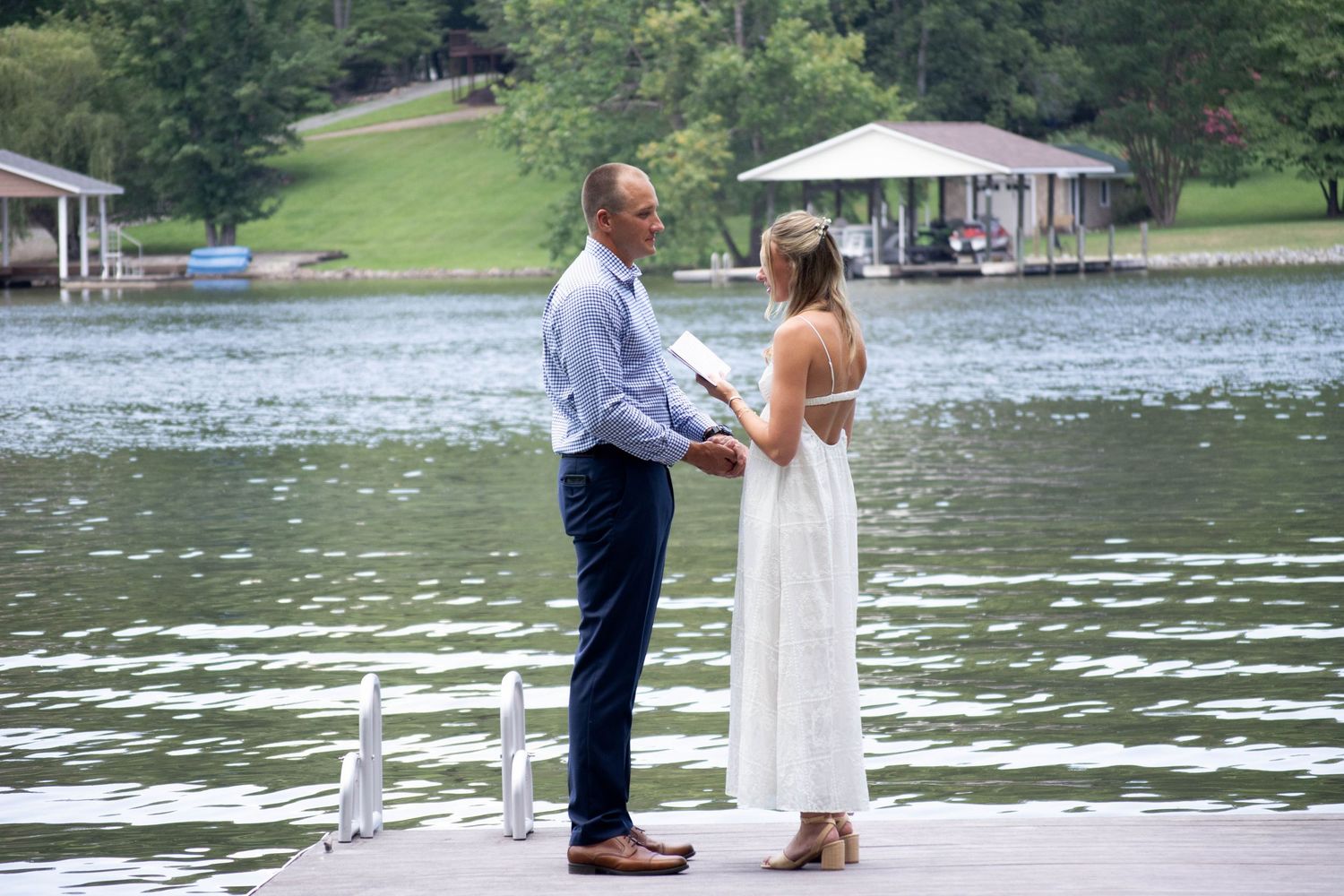 bride and groom reading vows