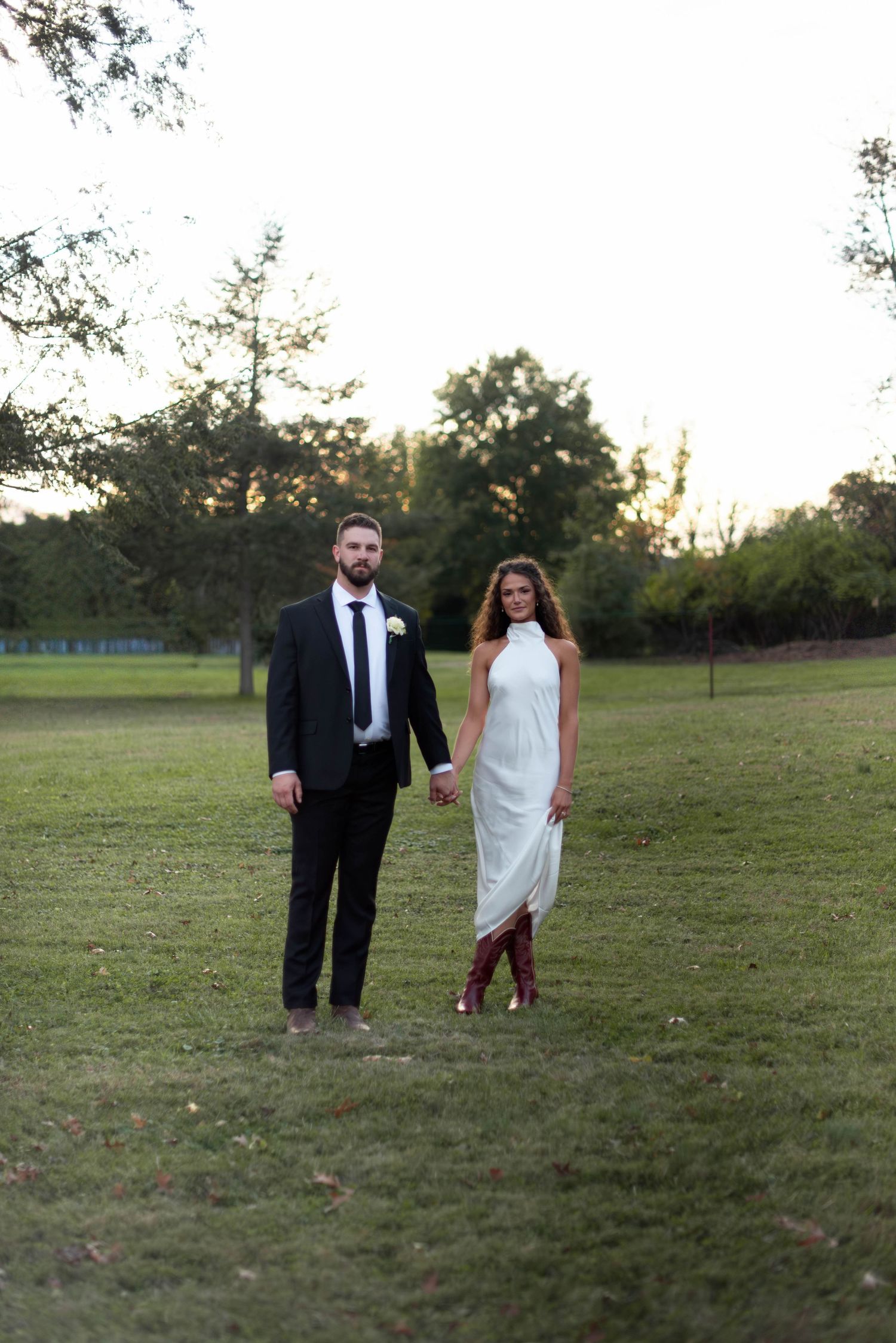 Bride and groom after wedding during reception looking at camera fiercely