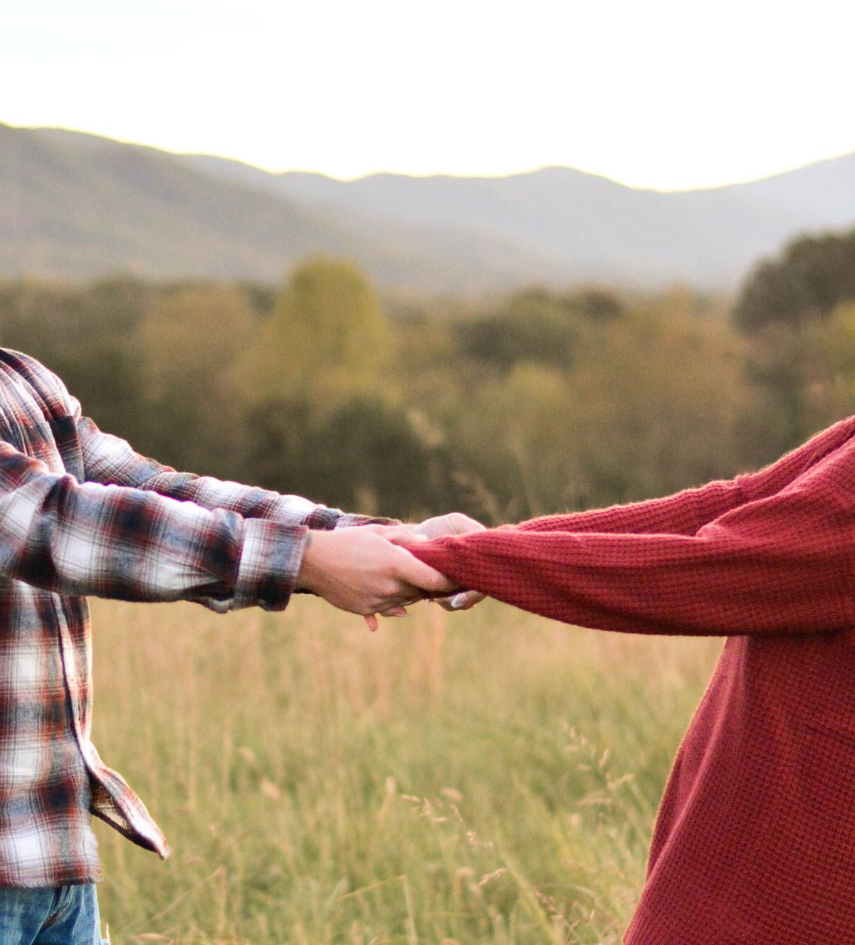 Mountain view couple holding hands during lifestyle engagement session