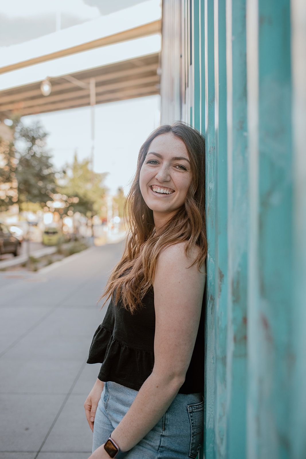 Girl smiling at camera.