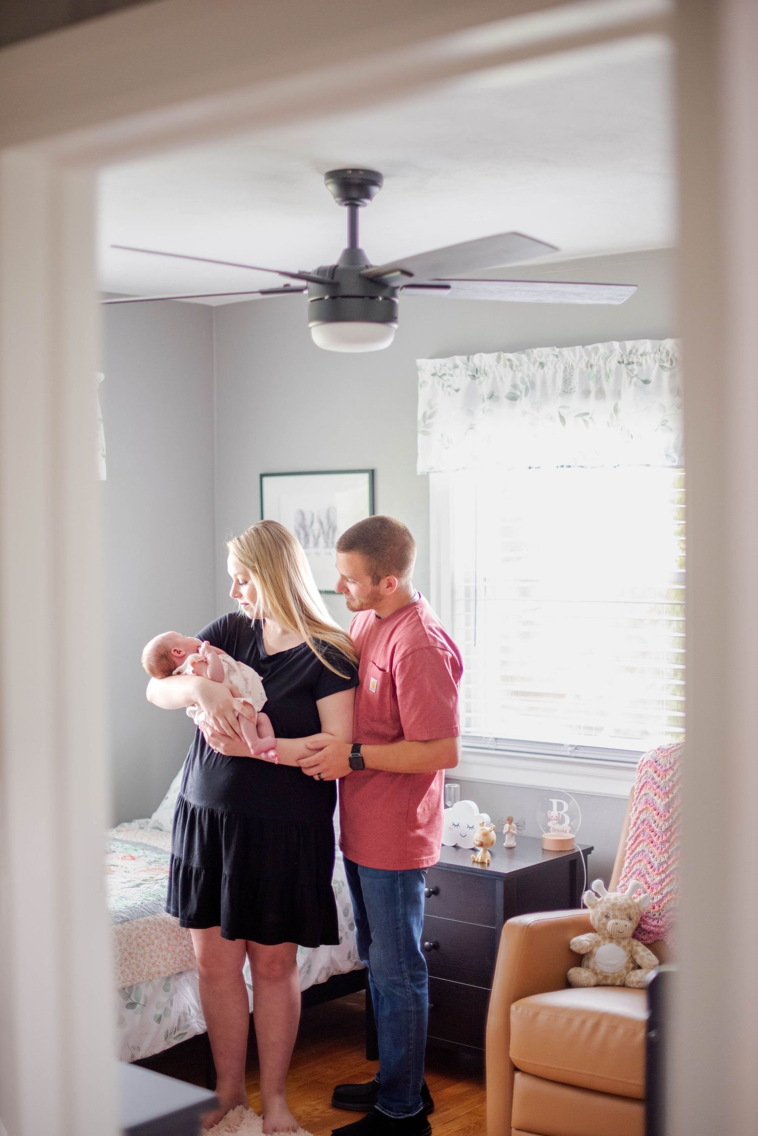New parents in nursery with newborn child