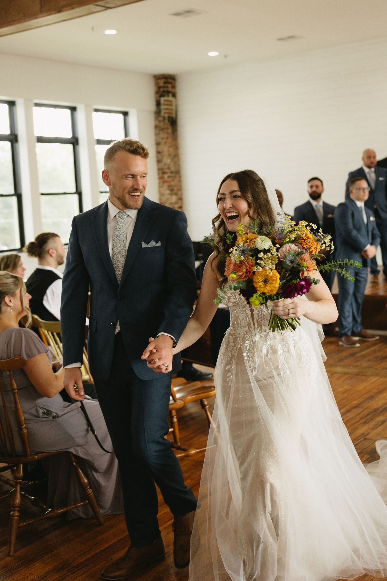 Bride and groom walking down the aisle