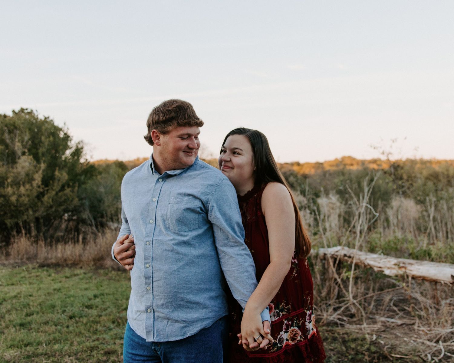 San Antonio Engagement Photography. Couple sharing a joyful moment together outdoors during golden hour.