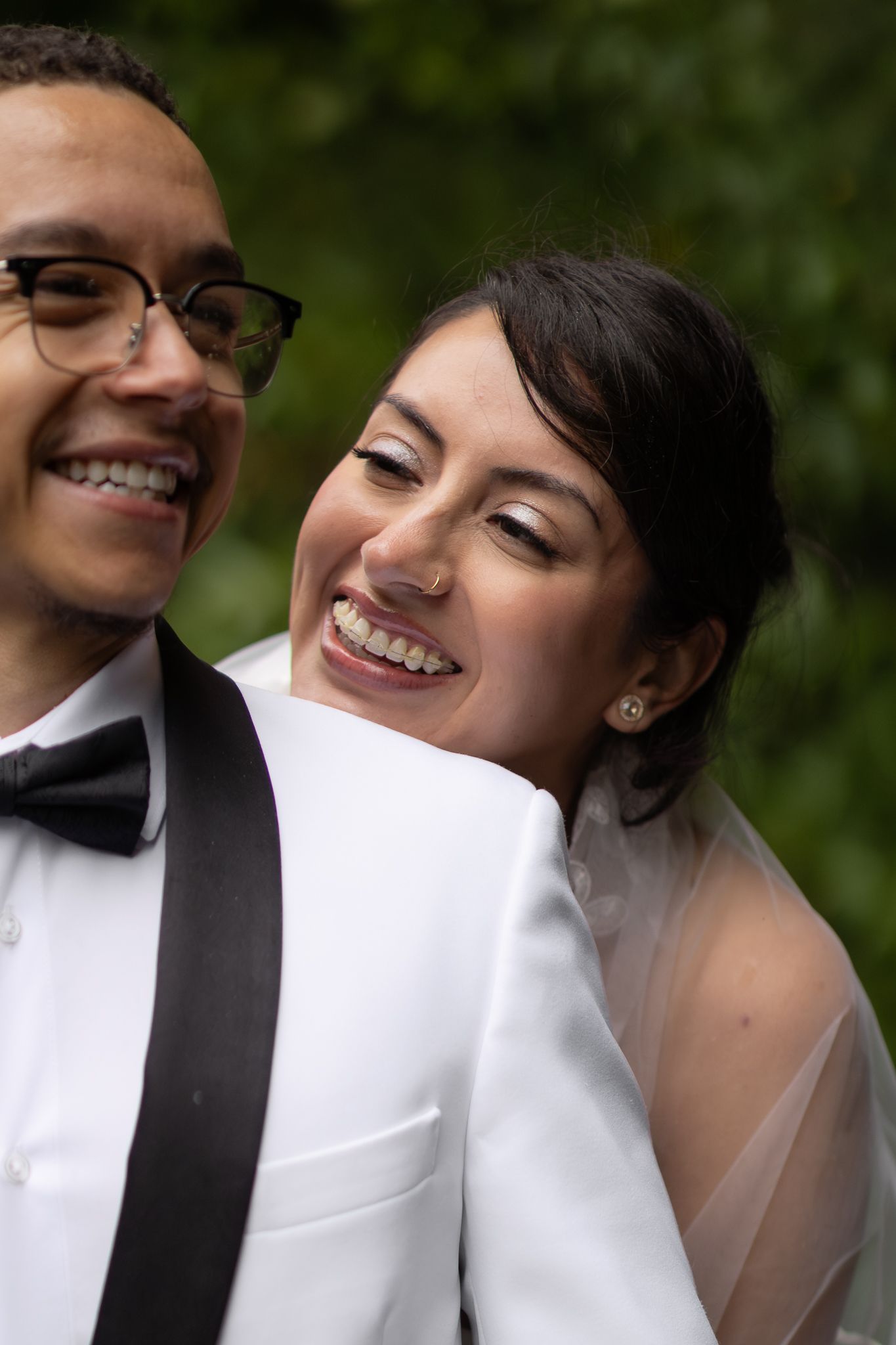 Bride Yuri smiles up at her new husband on their wedding day at Mount Rainier.