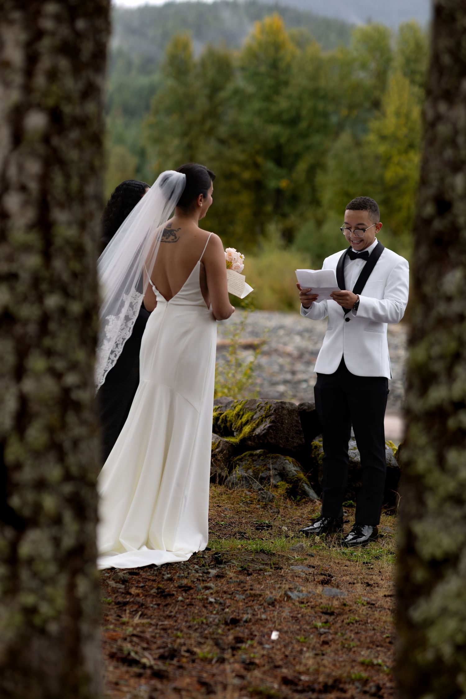 Groom reads his vows during the ceremony of his Washington elopement with Say Yes With Jess Photography.