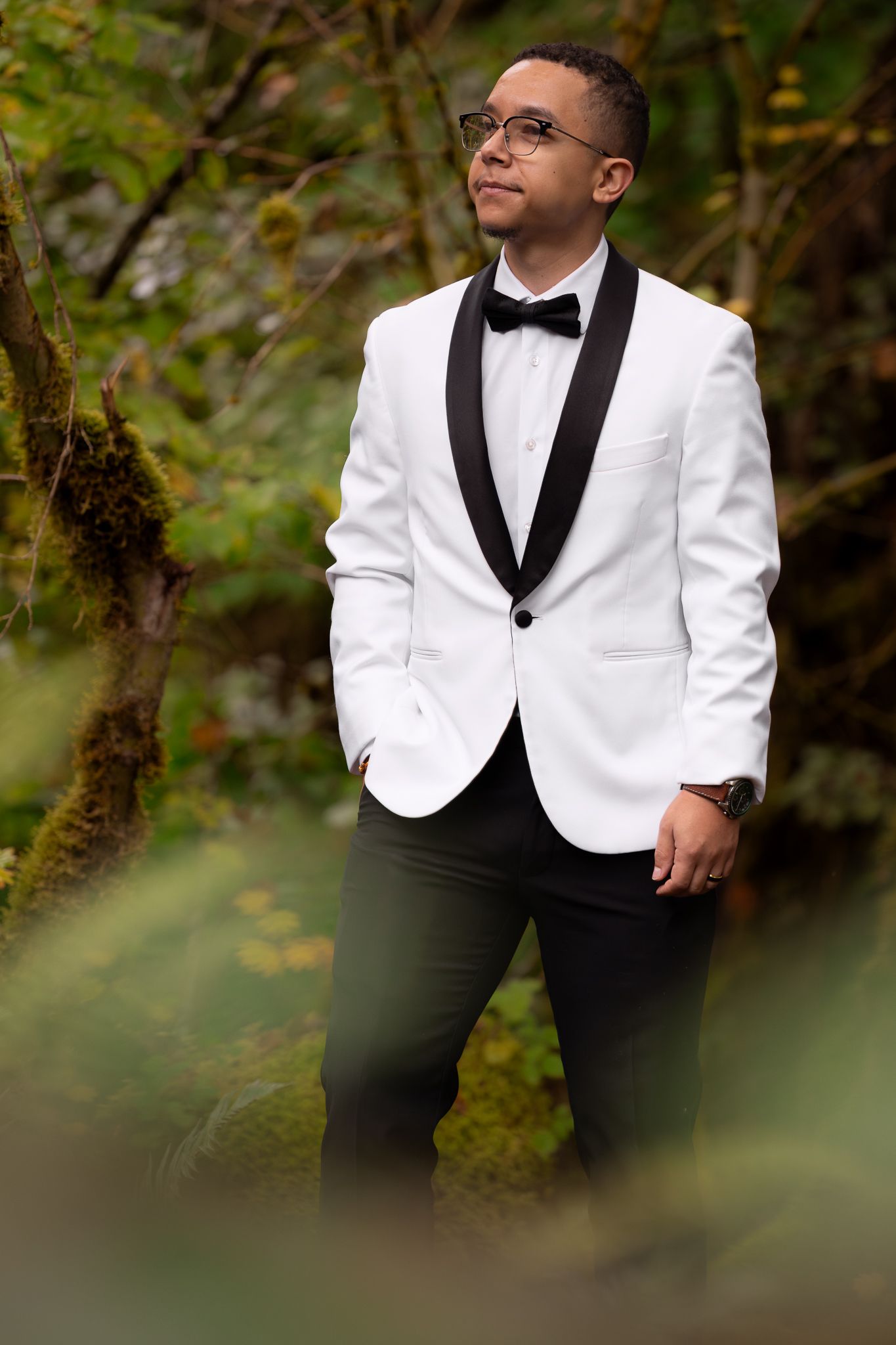 Formal groom portrait among the lush green ferns and forested nature of the pnw. Edited with contrast and clean vibrance.