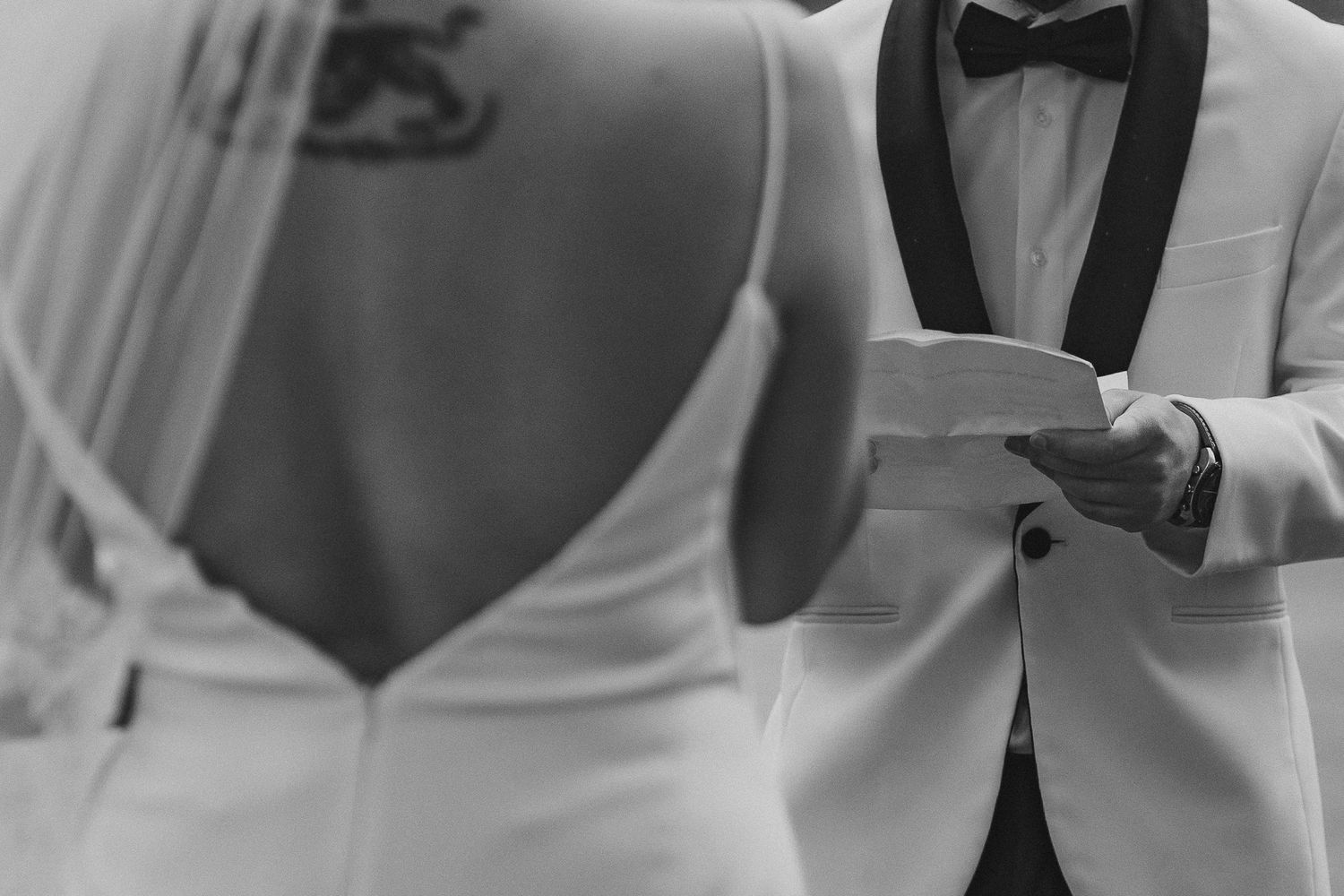 Timeless editorial black and white with sharp focus on the grooms vows during their elopement ceremony near Mount Rainier