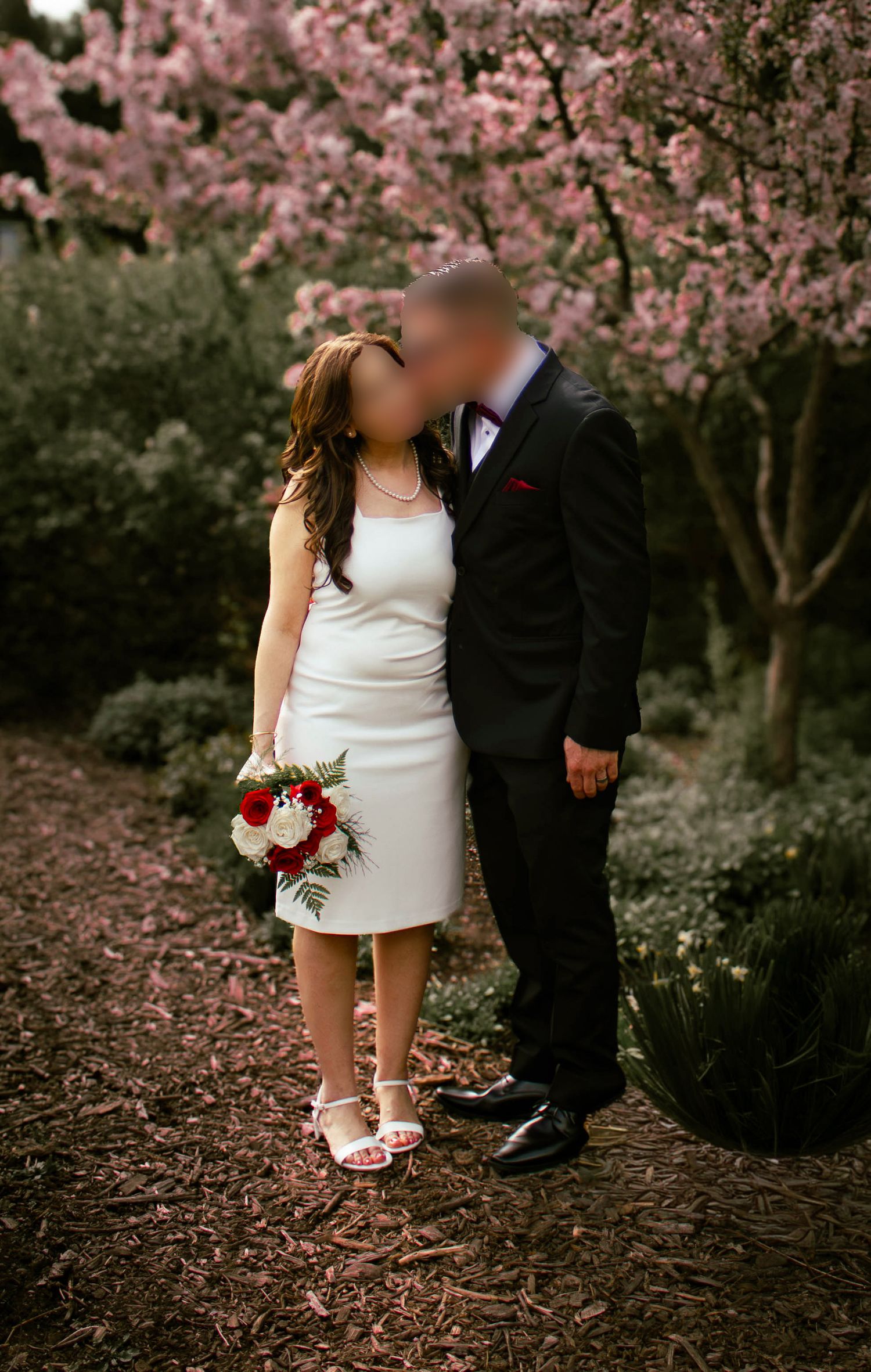 couple posing in a garden