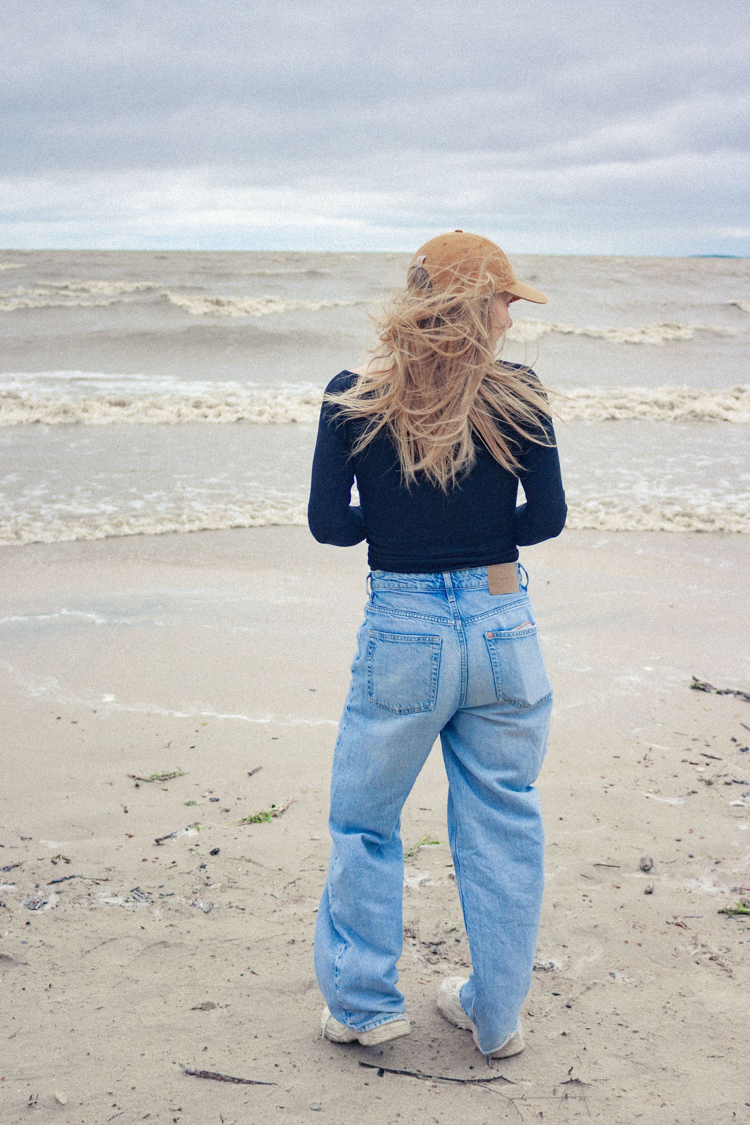 young woman posing at the beach
